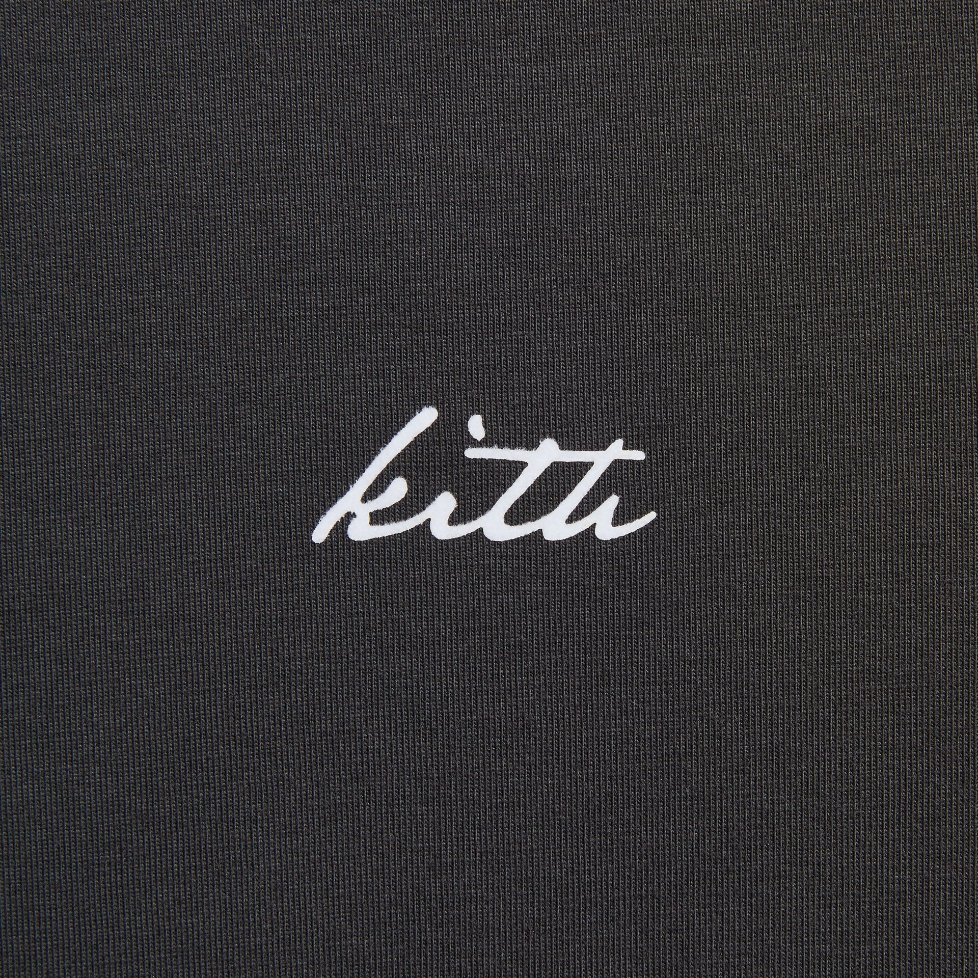 Close-up of the embroidered Kith script logo on the LAX tee in black