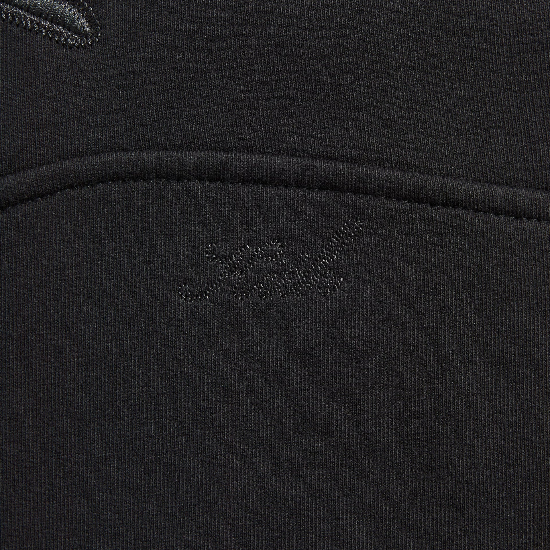 Close-up of the tonal embroidered logo on the pocket of the Kith Heritage Filigree Braxton hoodie