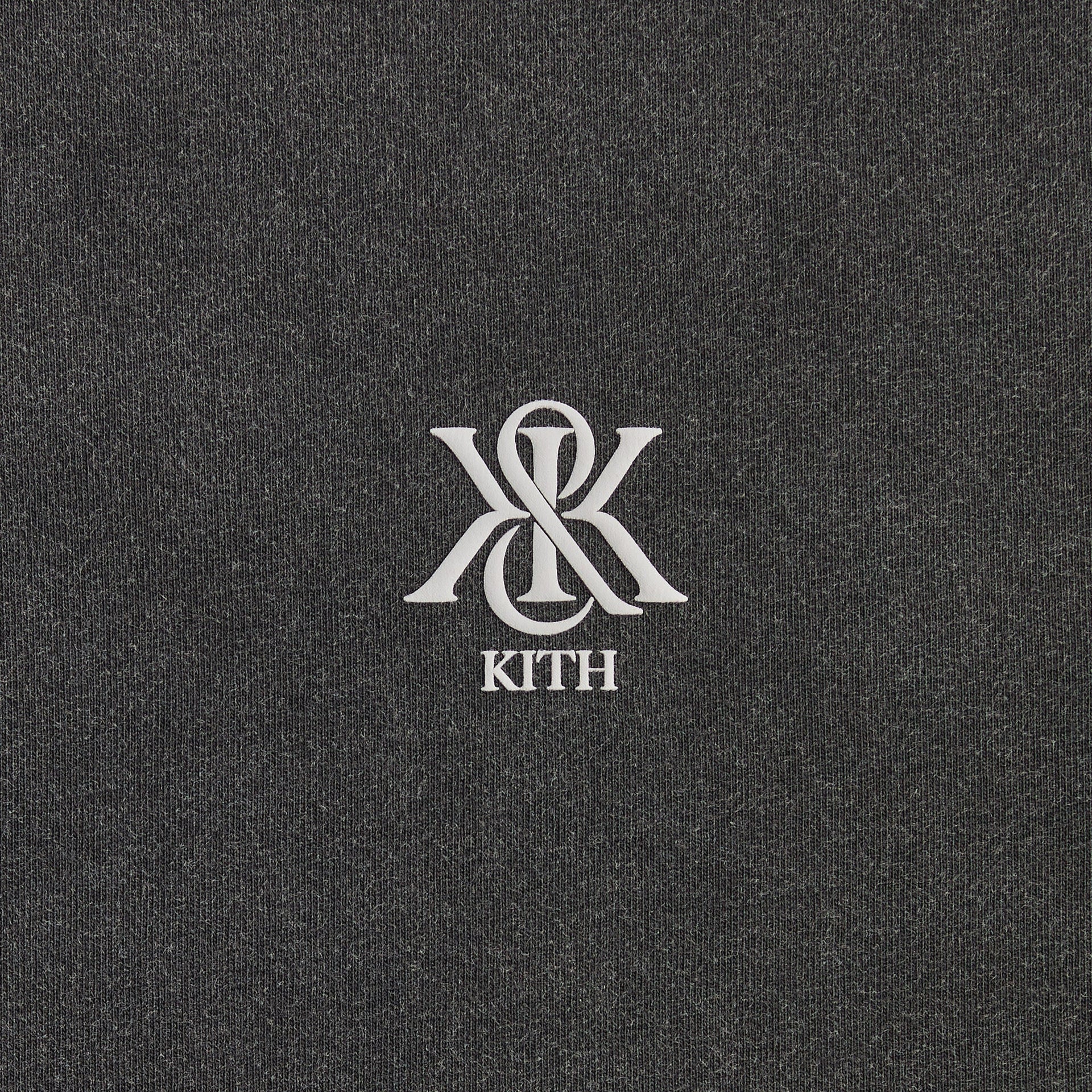 Close-up of the small monogram Kith chest logo on the Guardian Alex boxy vintage tee