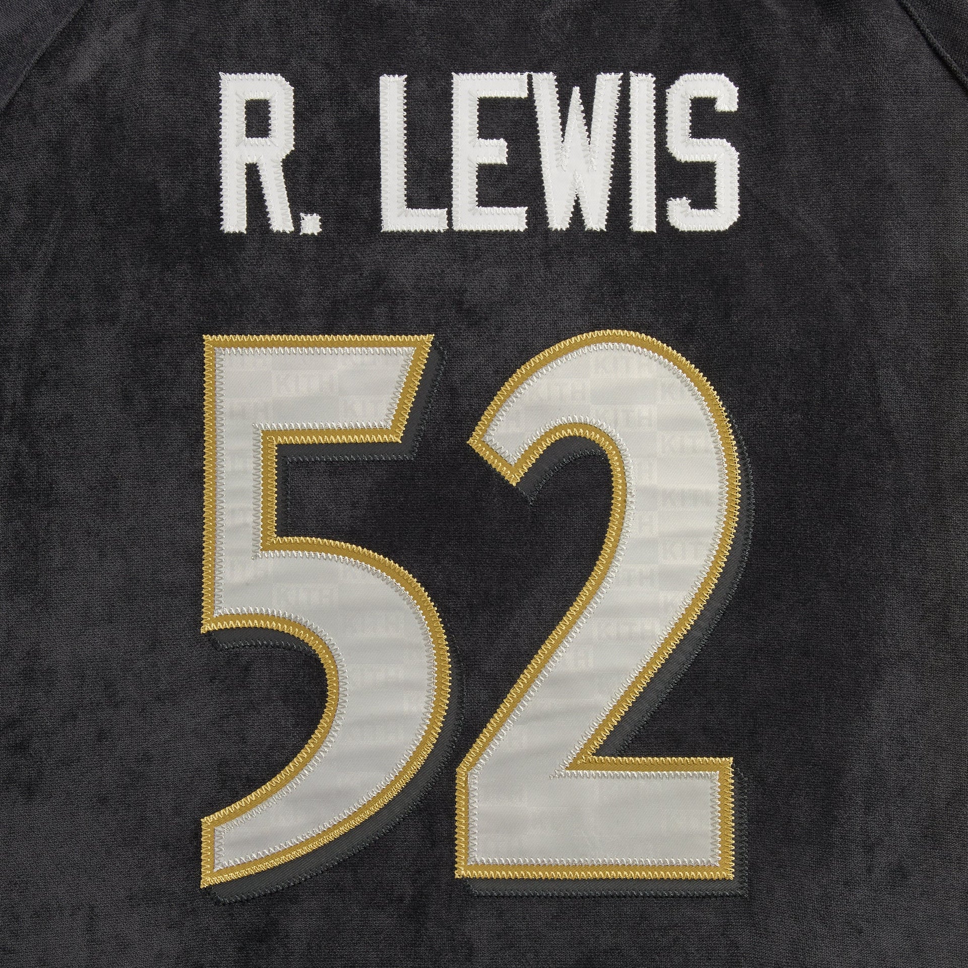 Close-up of the R. Lewis 52 name and number on the back of the Kith NFL Ravens Leon shirt