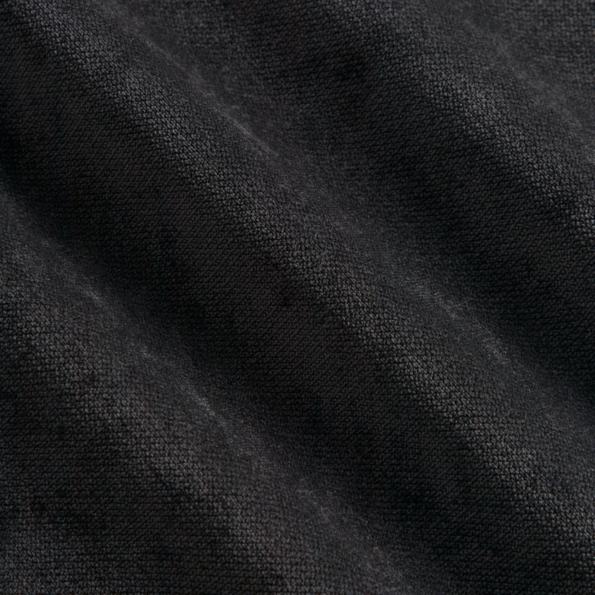 Close-up of the black jersey fabric texture on the Kith NFL Steelers Leon shirt