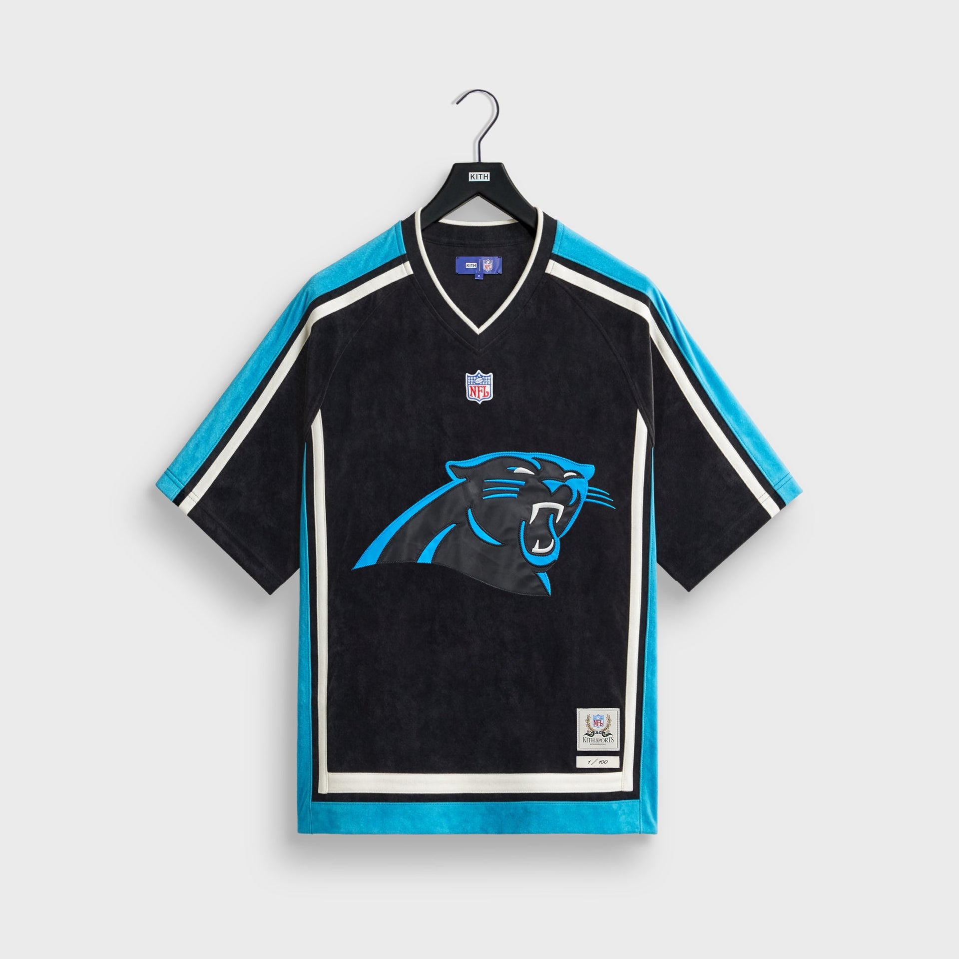 Kith and the NFL for the Carolina Panthers Leon shirt in black with teal trim, front flat lay