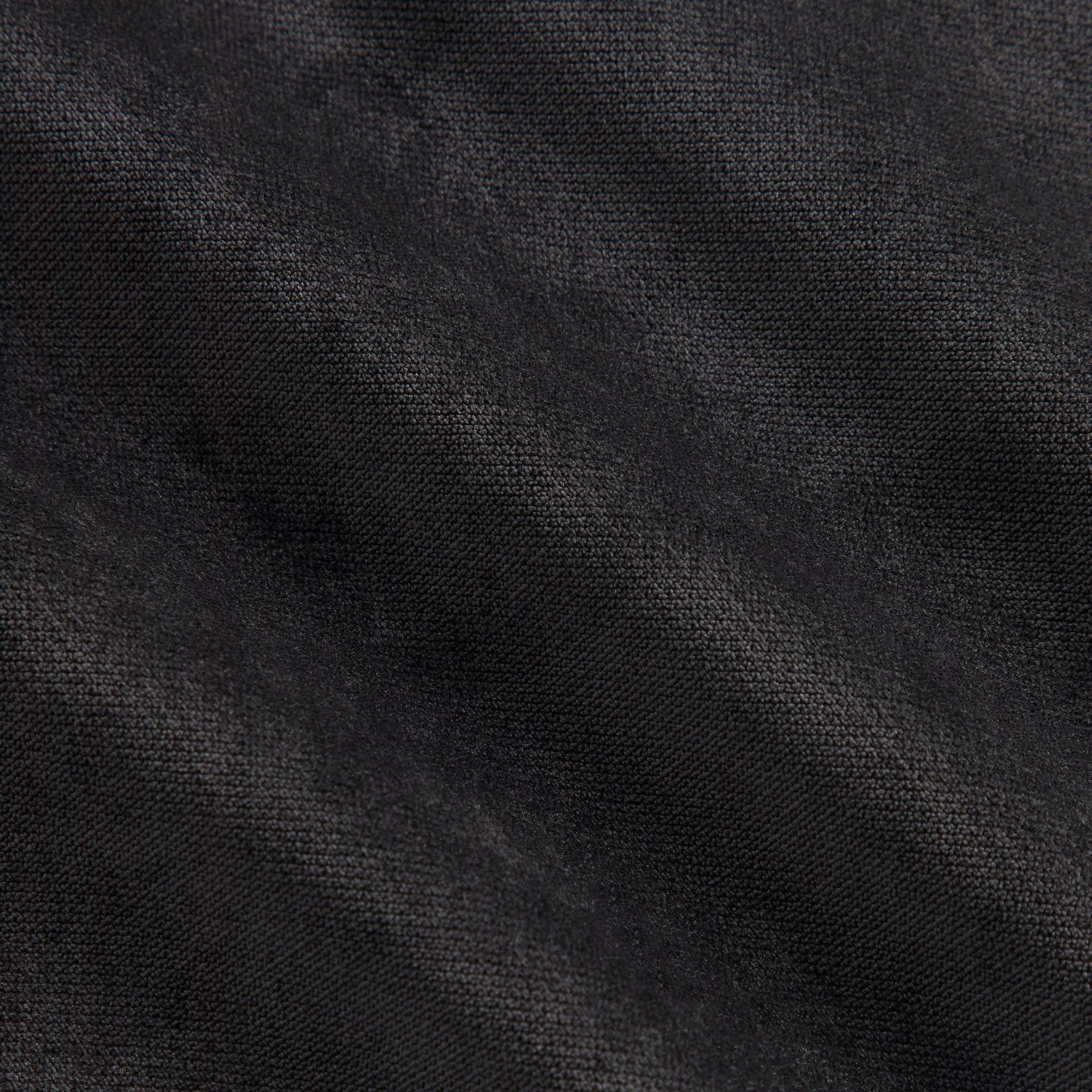 Close-up of the black jersey fabric texture on the Kith NFL Panthers Leon shirt