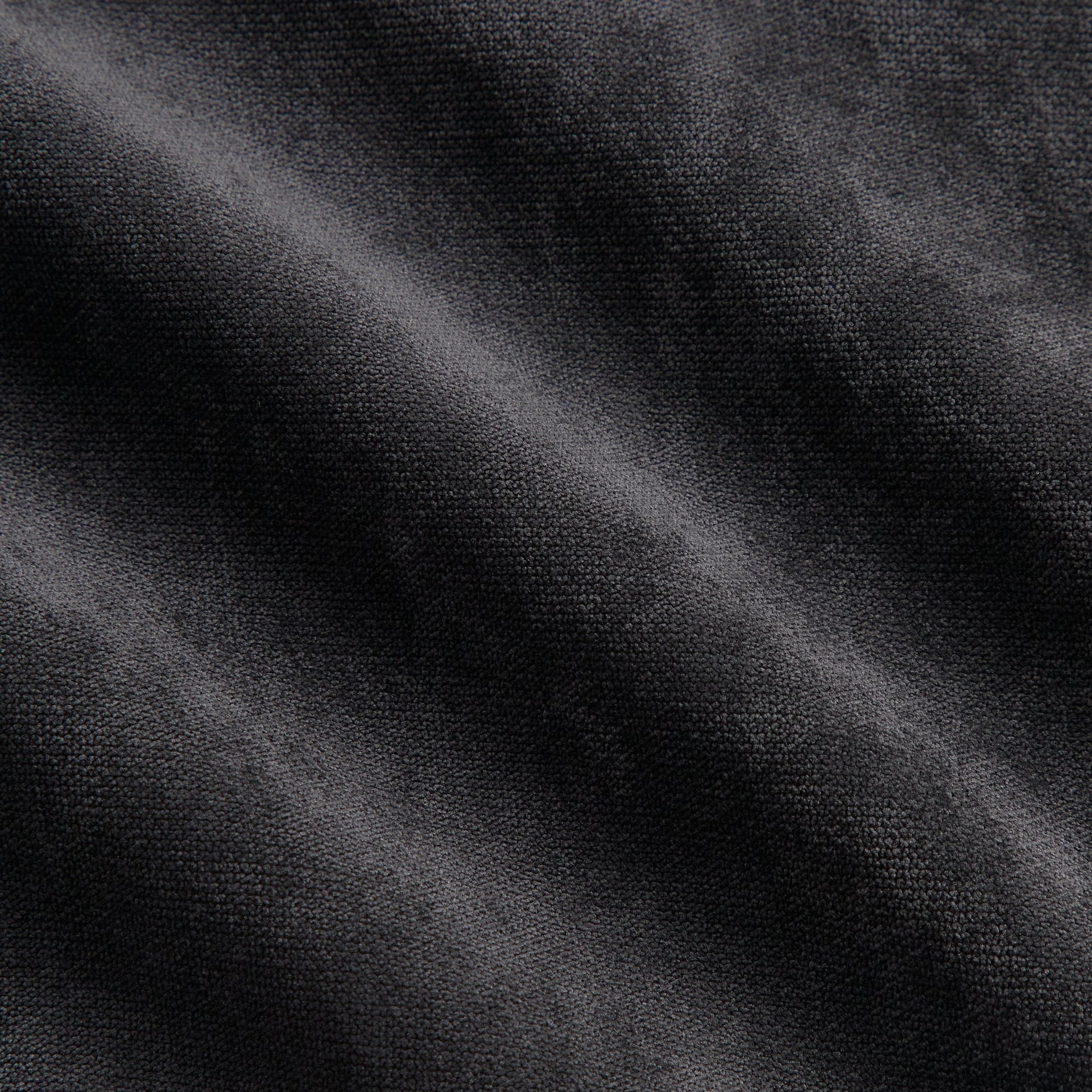 Close-up of the black jersey fabric texture on the Kith NFL Bengals Leon shirt