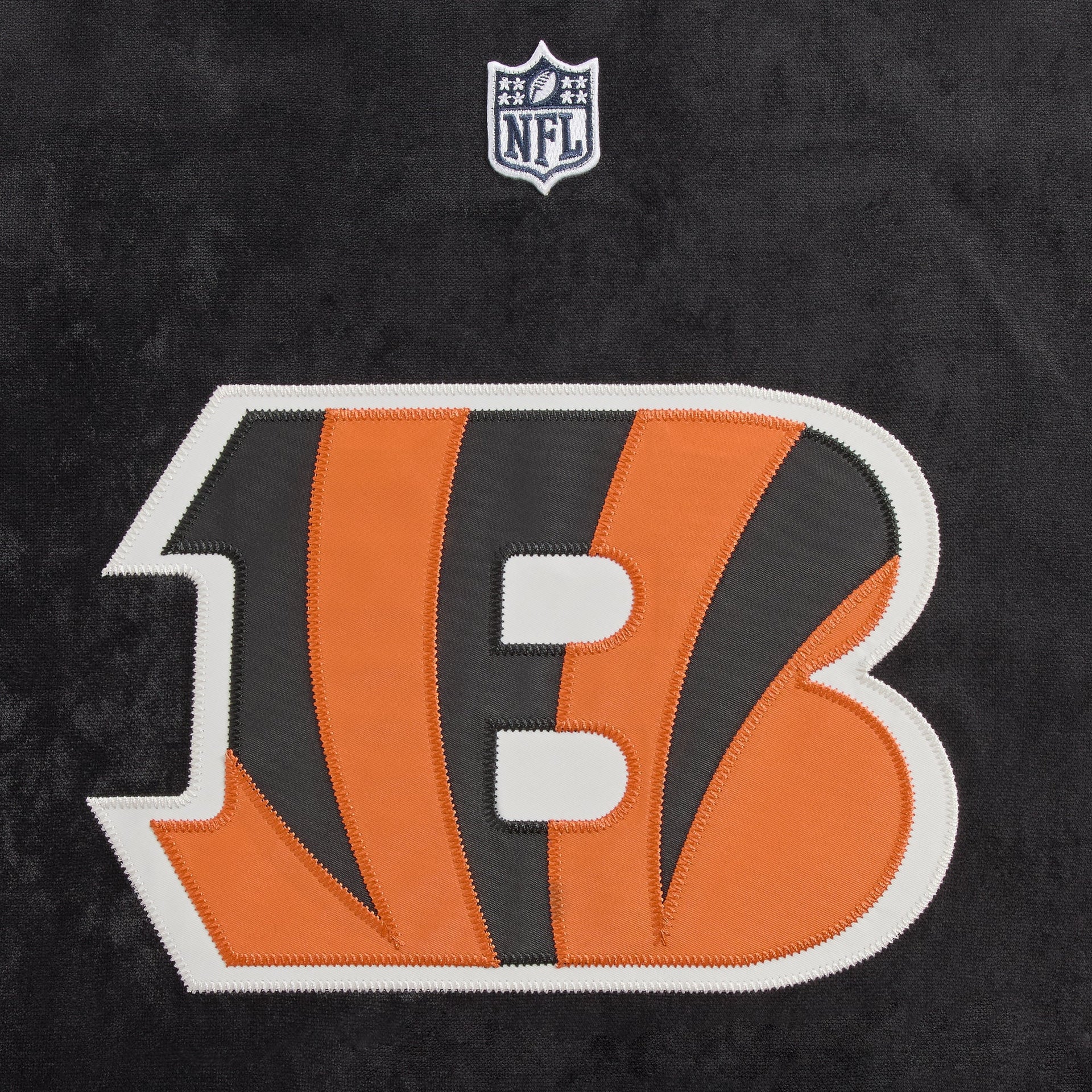 Close-up of the Cincinnati Bengals logo patch on the Kith NFL Leon shirt