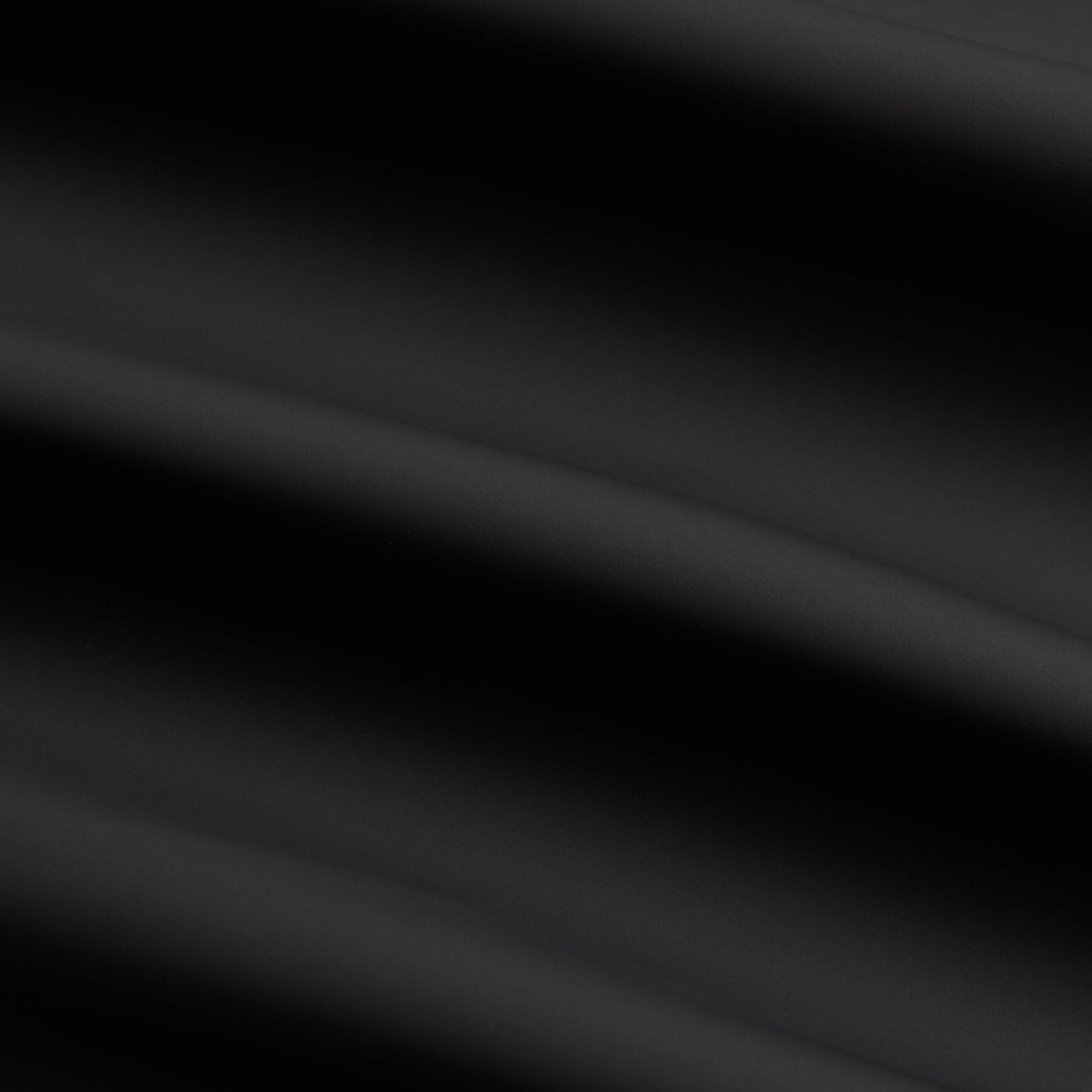 Kith Stretch Poly Brixton Shirt Jacket in black, close-up of smooth stretch poly fabric with soft folds