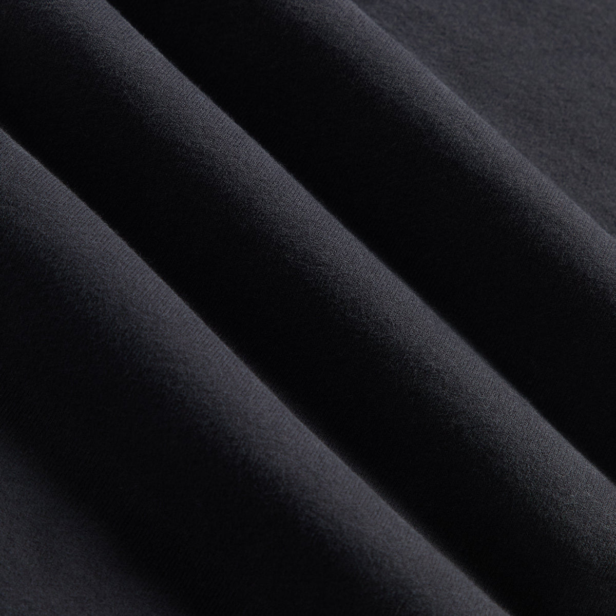 Kith Sueded French Terry Nelson Rugby Pullover in Black, fabric detail close-up of soft draped sueded French terry