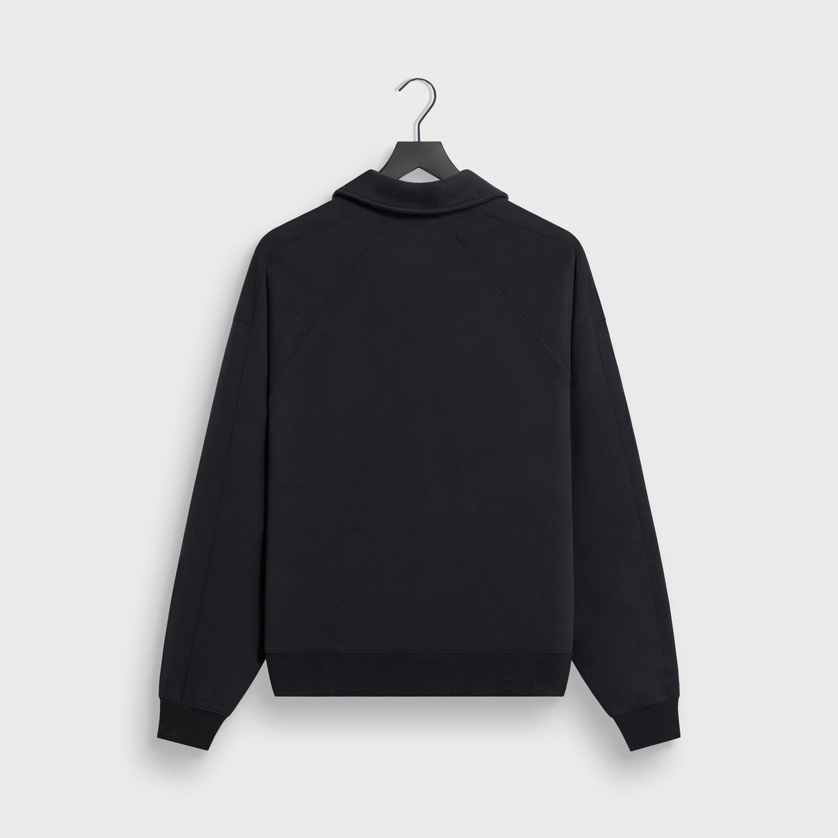 Kith Sueded French Terry Nelson Rugby Pullover in Black, back view on hanger showing raglan seams, collar and ribbed cuffs