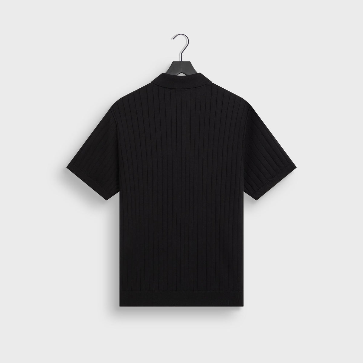 Kith Ivy Knit Tilden Polo in black on hanger, back view showing vertical rib knit