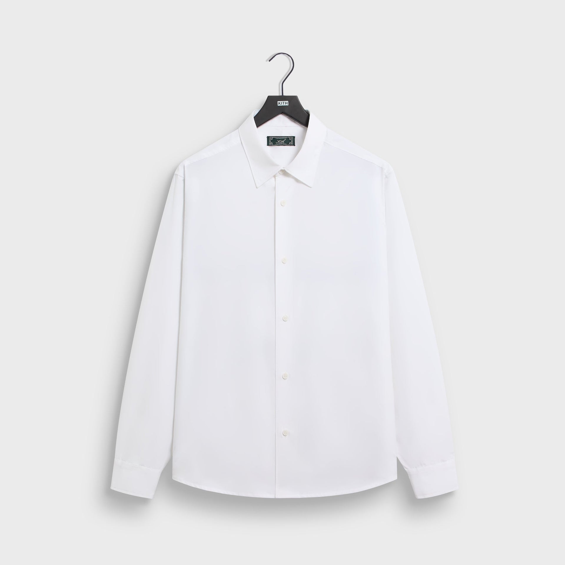 &Kin Poplin Georgie Shirt in white, front view on KITH hanger, point collar and button placket
