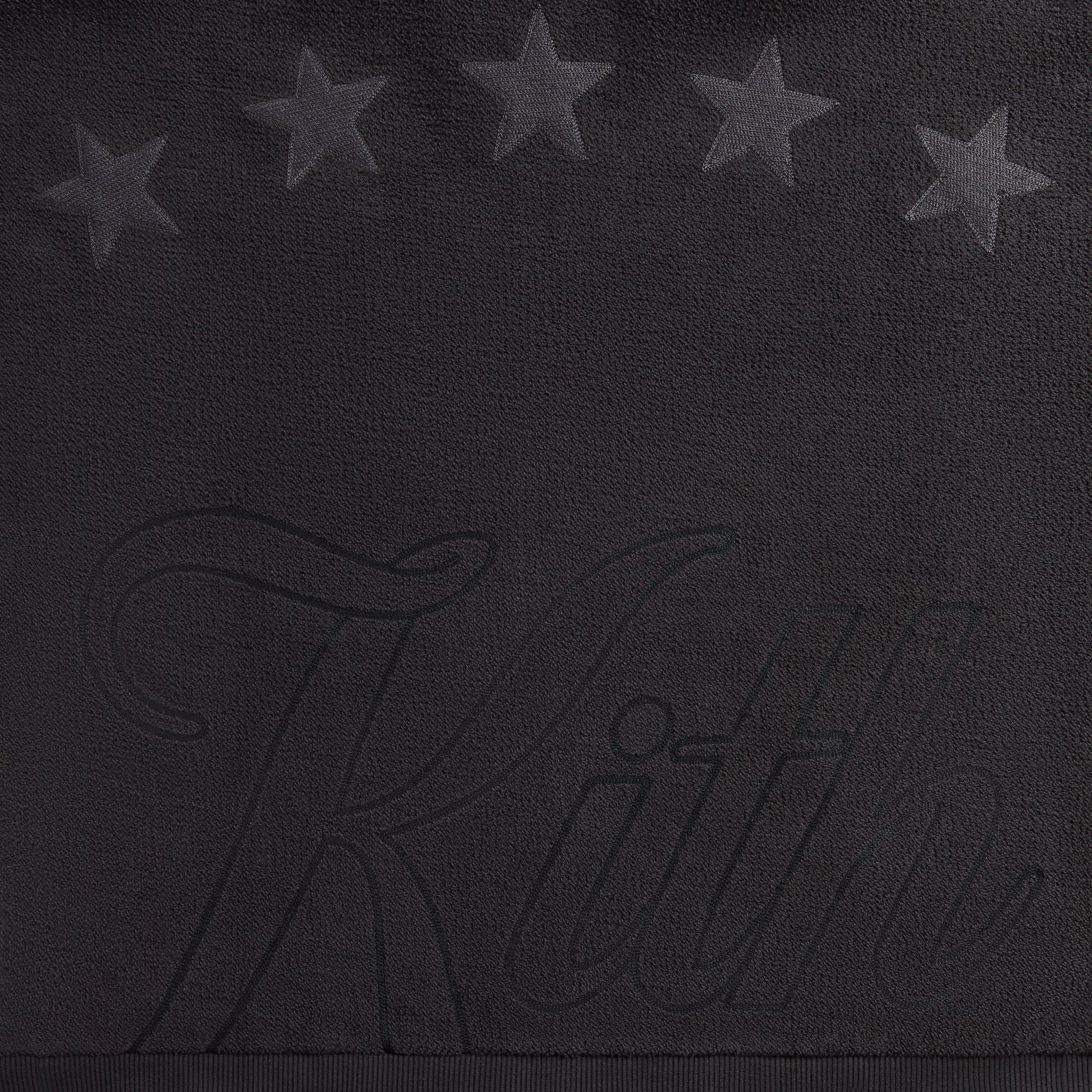 Close-up of the tonal star graphics and Kith script on the back of the Varsity Braxton hoodie