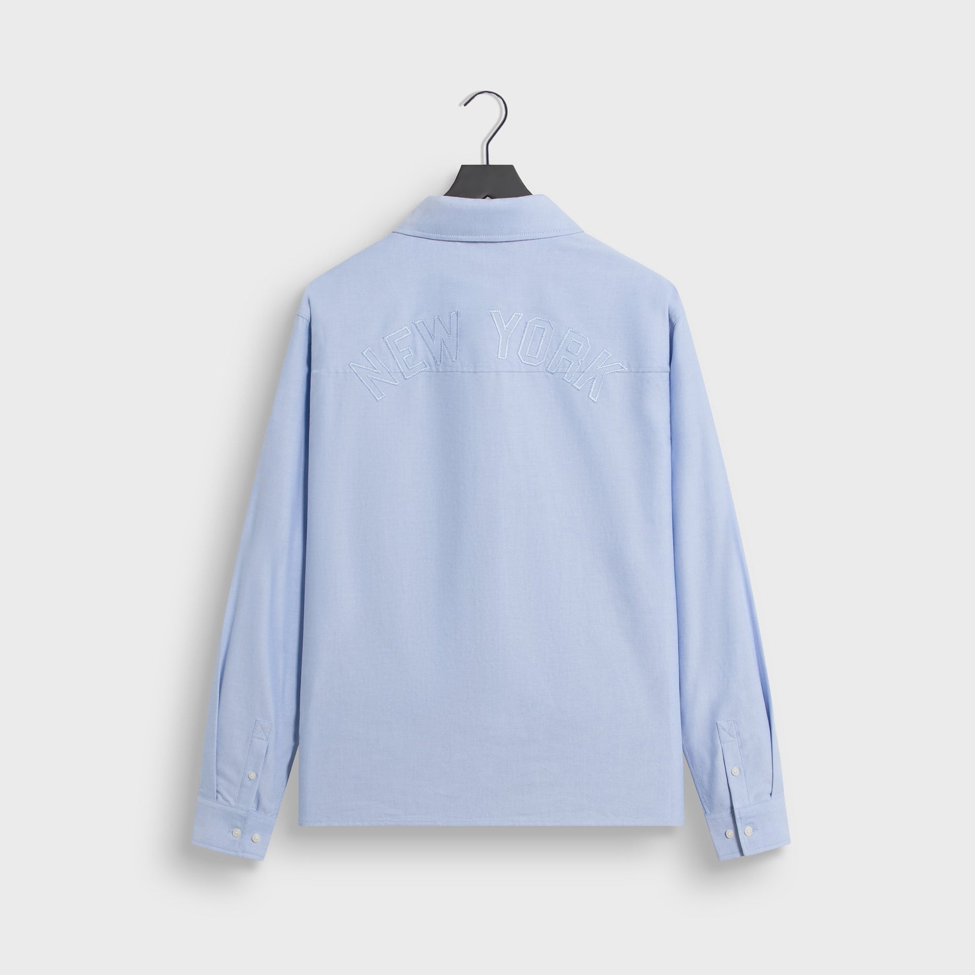 Back flat lay of Kith for New York Yankees Oxford Deon overshirt in light blue with New York embroidery