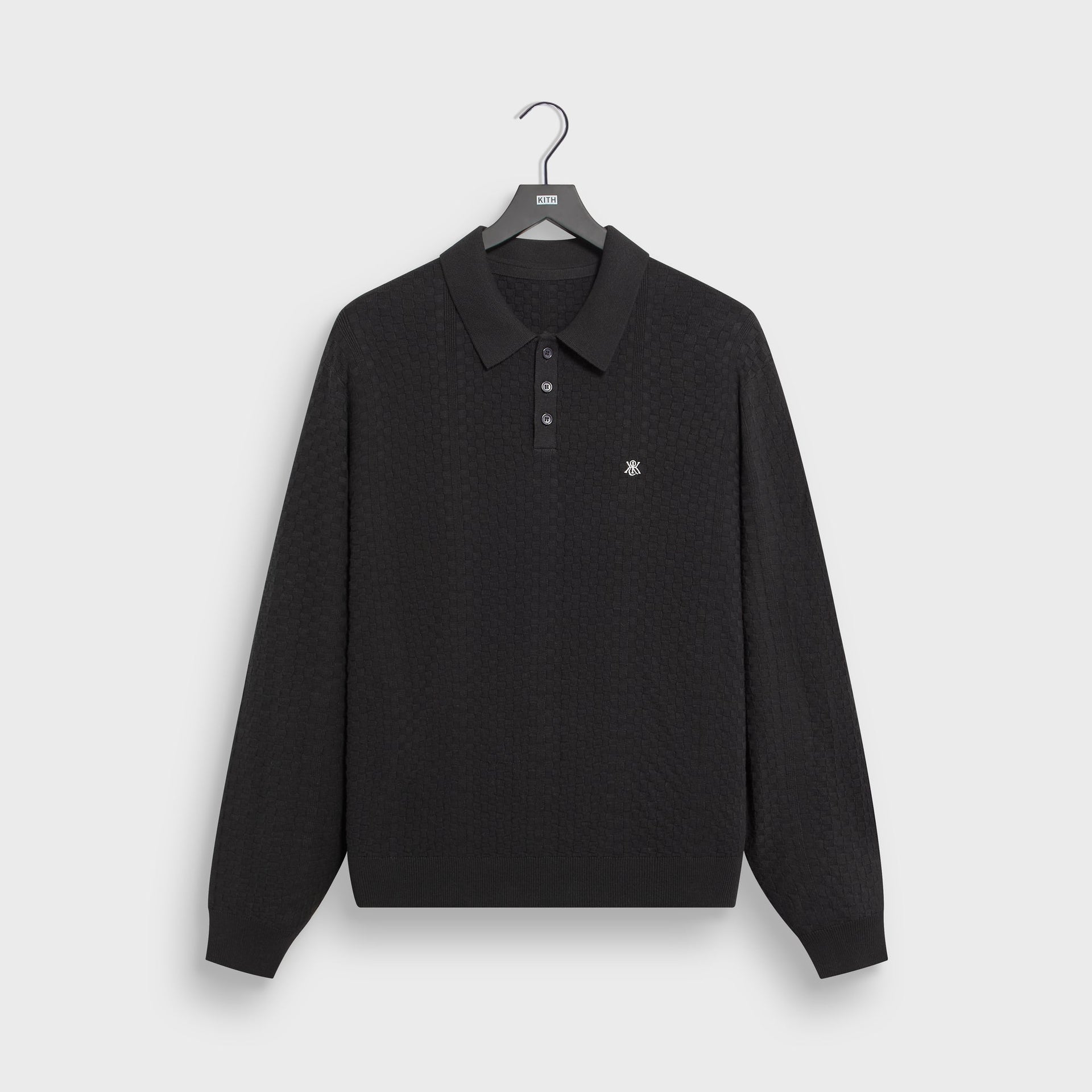 Kith Long Sleeve Tilden pullover in black textured knit with polo collar, front flat lay