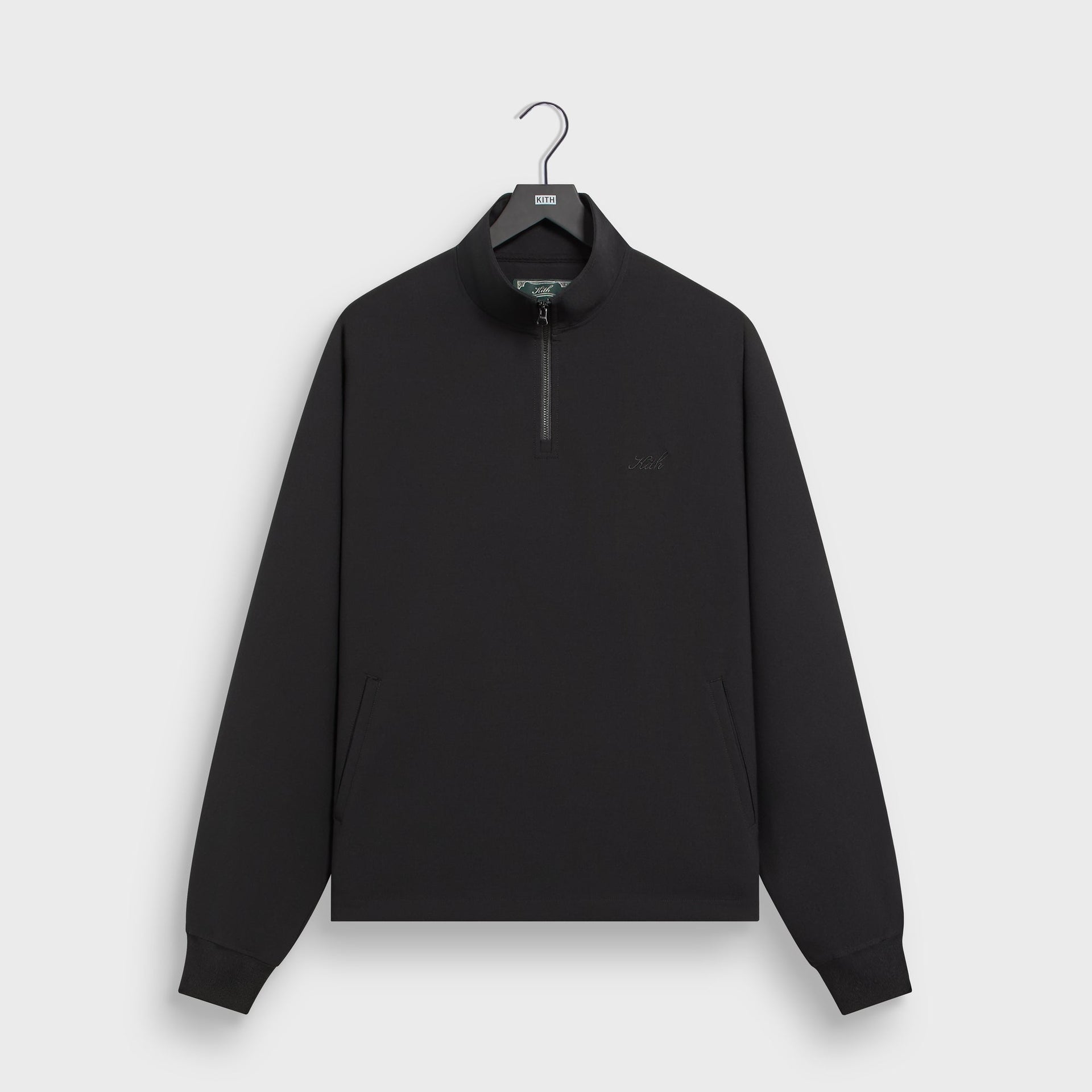 Kith Davis quarter zip pullover in black with stand collar, front flat lay
