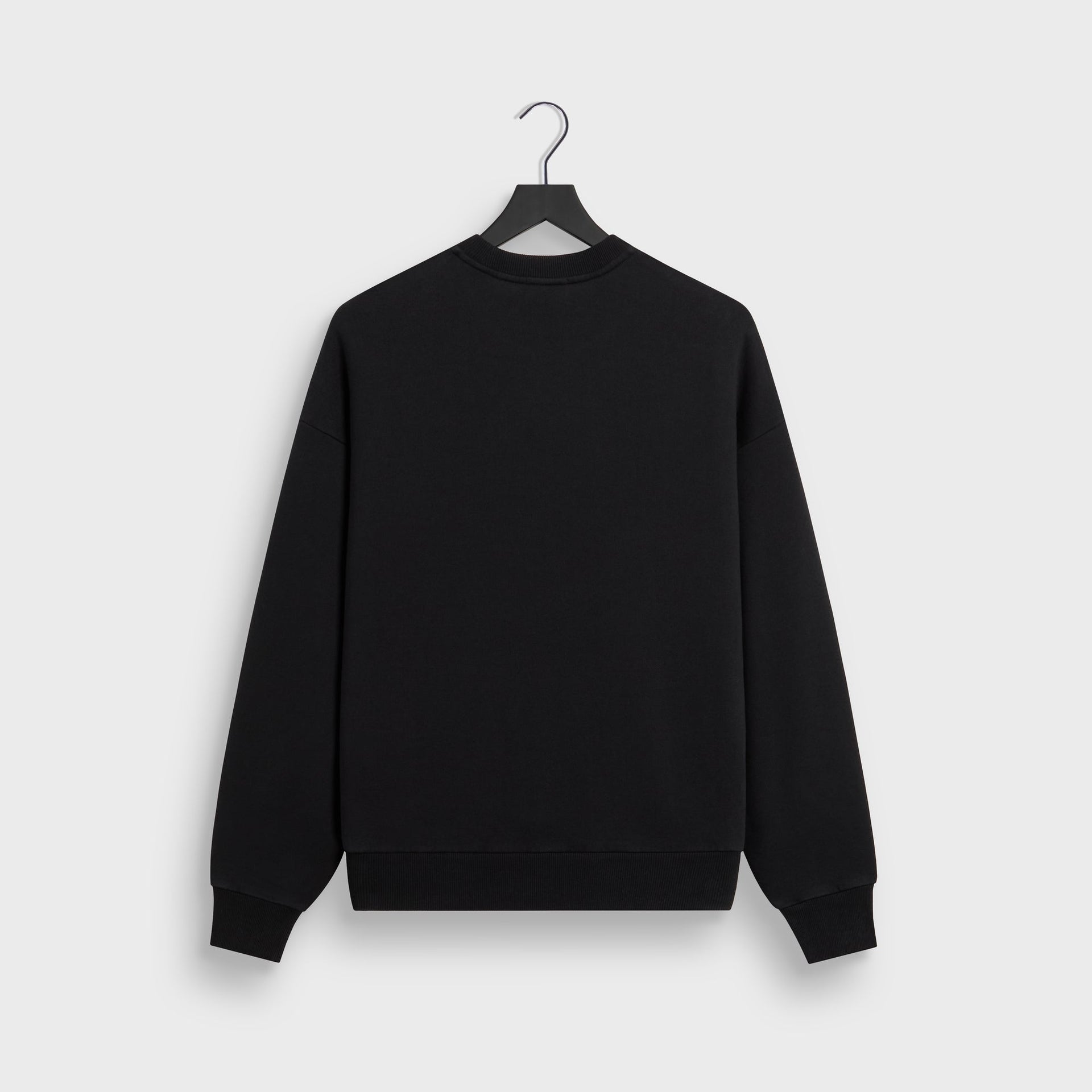 Kith Nelson crewneck in black cotton fleece, back flat lay on hanger