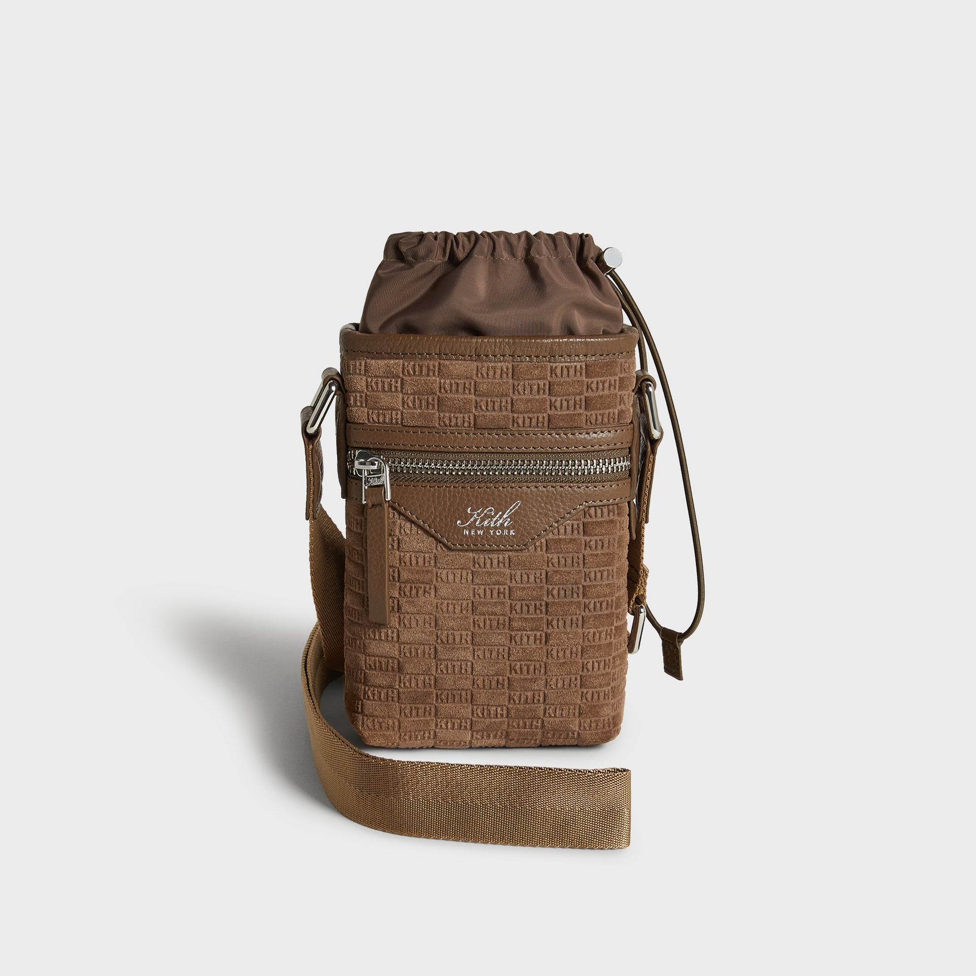 Kith Monogram Suede Drawstring Pouch in Java, front view with drawstring nylon top and crossbody strap