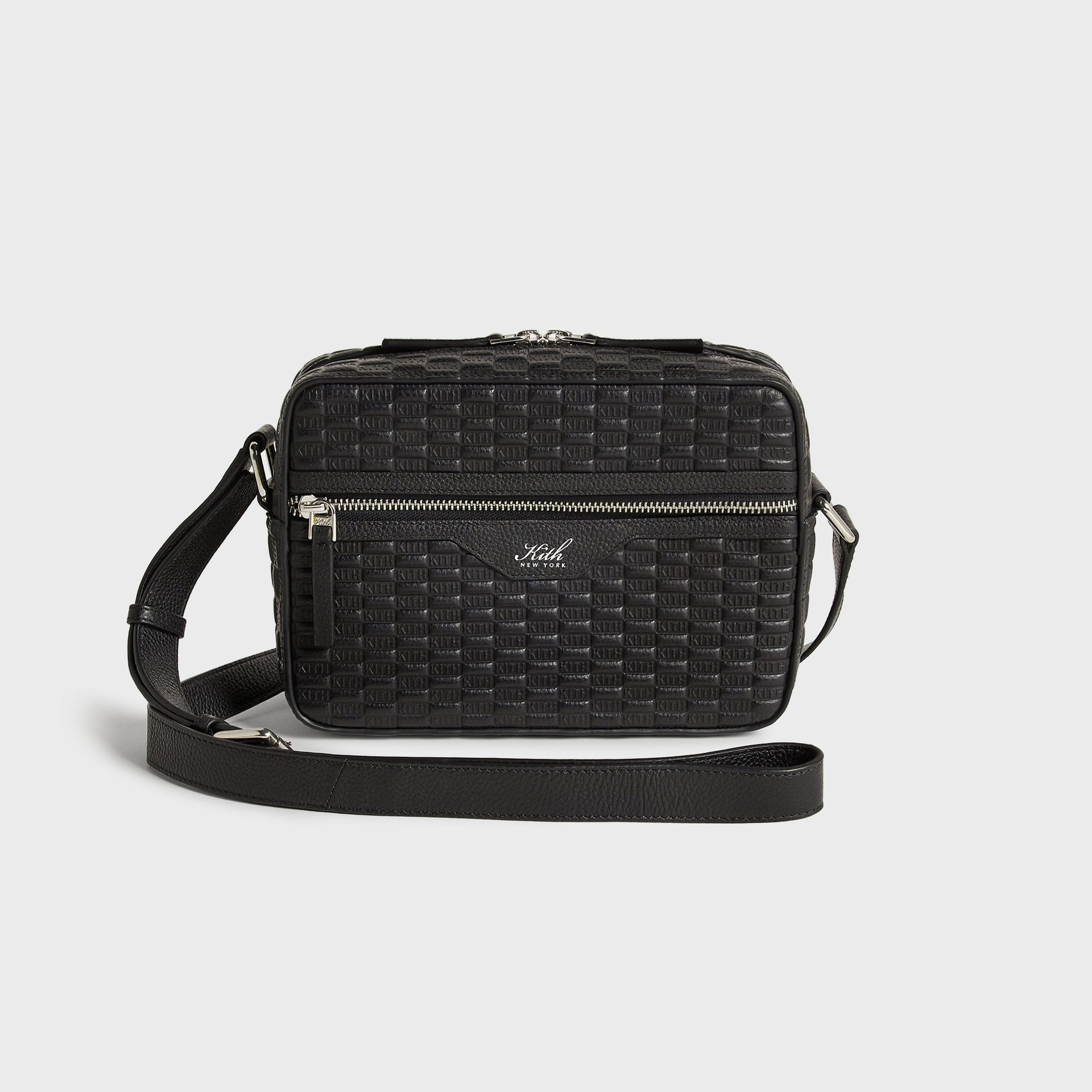 Kith Monogram Tumbled Leather Camera Crossbody Bag in Black, front view with embossed KITH pattern and strap