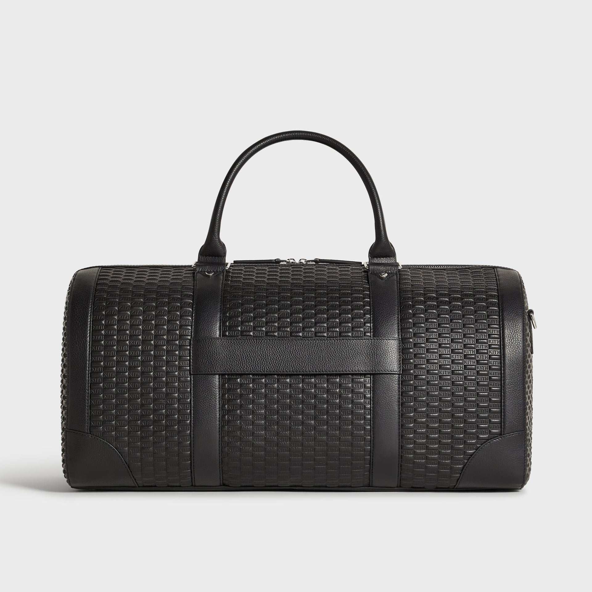 Kith Monogram Tumbled Leather Traveler K55 Duffle Bag in black, back view showing the embossed KITH monogram pattern across the main panel.