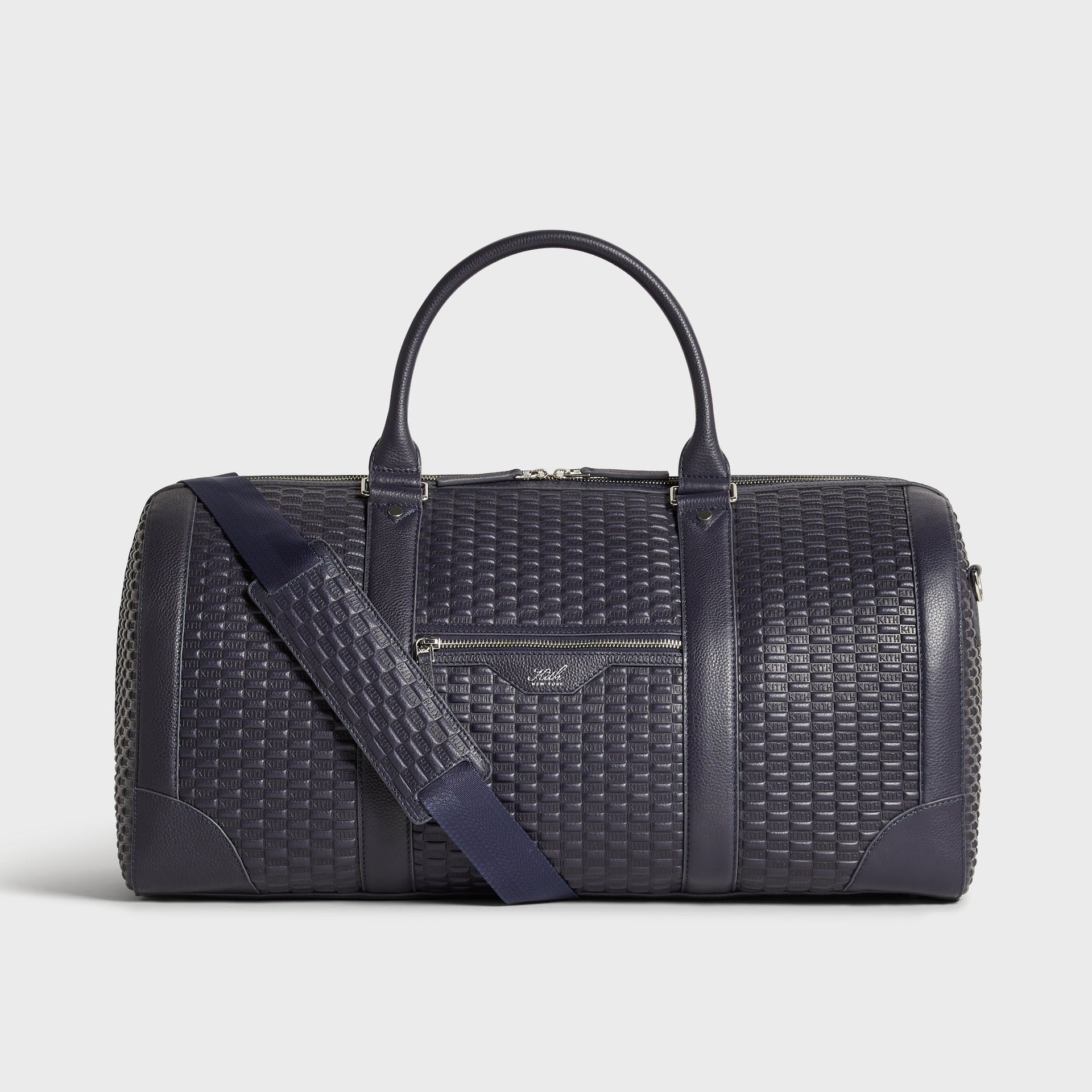 Kith Monogram Tumbled Leather Traveler K55 Duffle Bag in Ink, front view with rolled top handles
