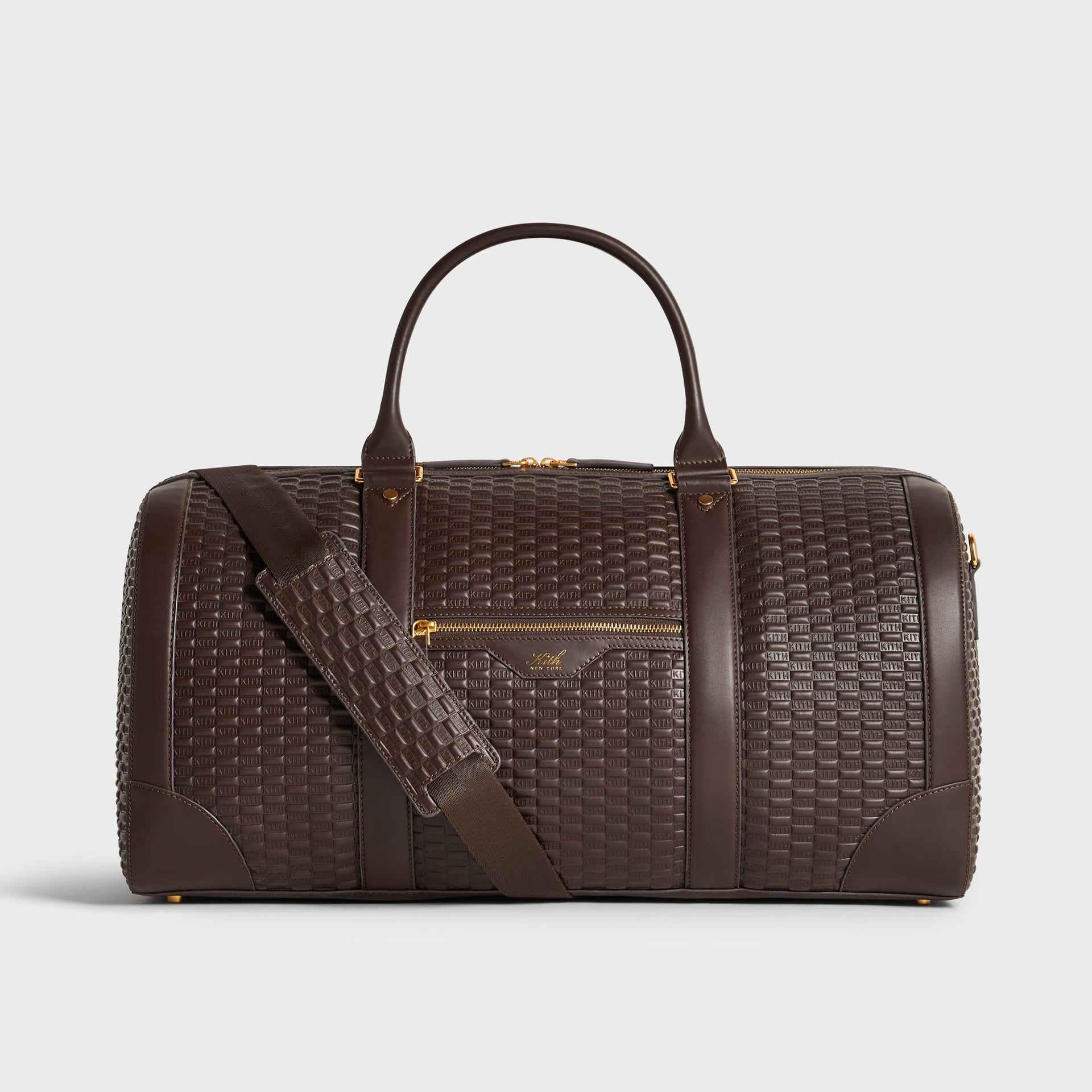 Kith Monogram Smooth Leather Traveler K55 Duffle Bag in Zoom brown, front view with crossbody strap draped across