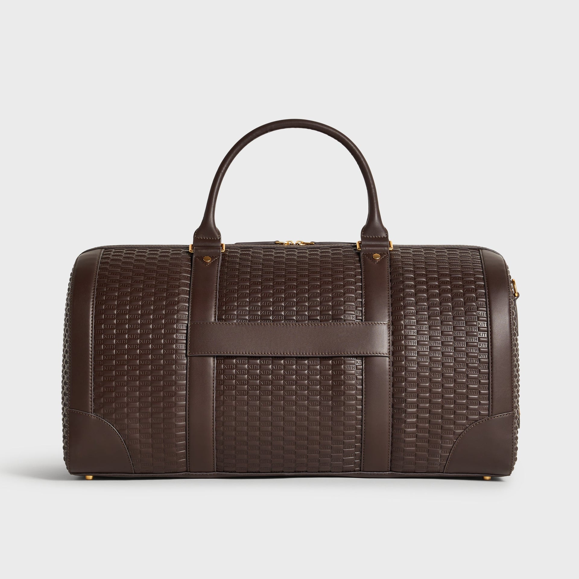 Kith Traveler K55 Duffle Bag front view with top handles and horizontal carry strap, embossed KITH leather