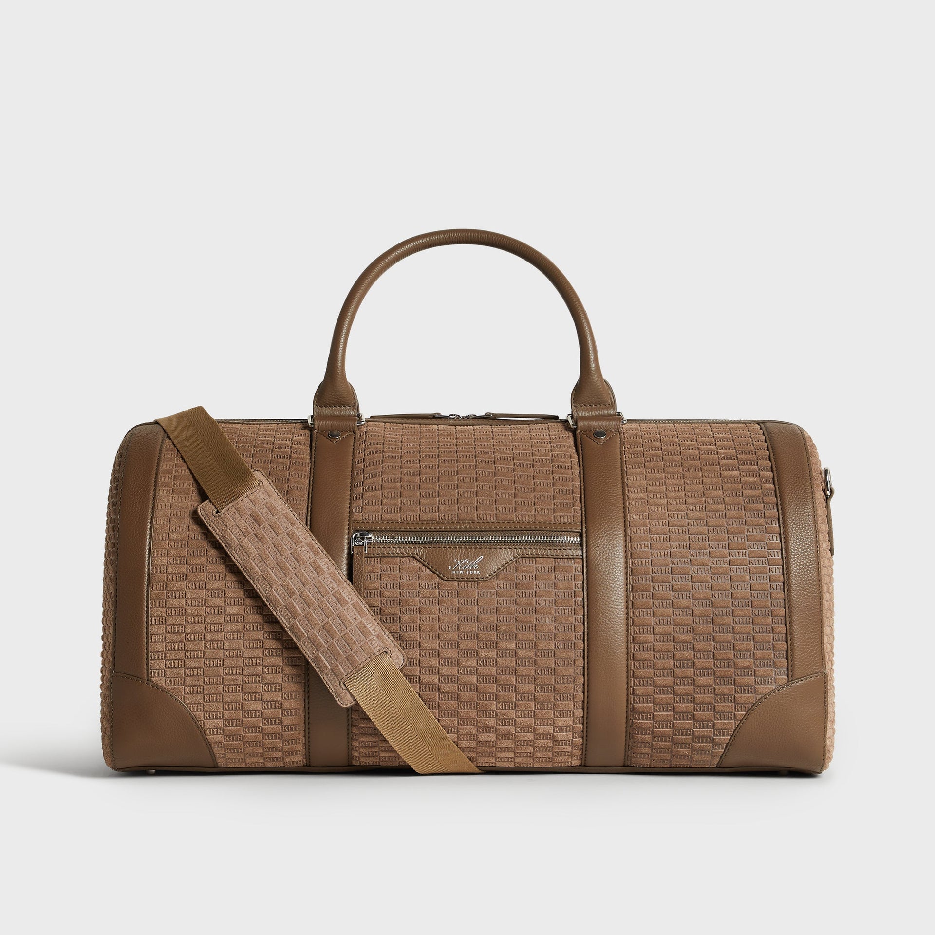 Kith Monogram Suede Traveler K55 Duffle Bag in Java brown, front view with crossbody strap draped across