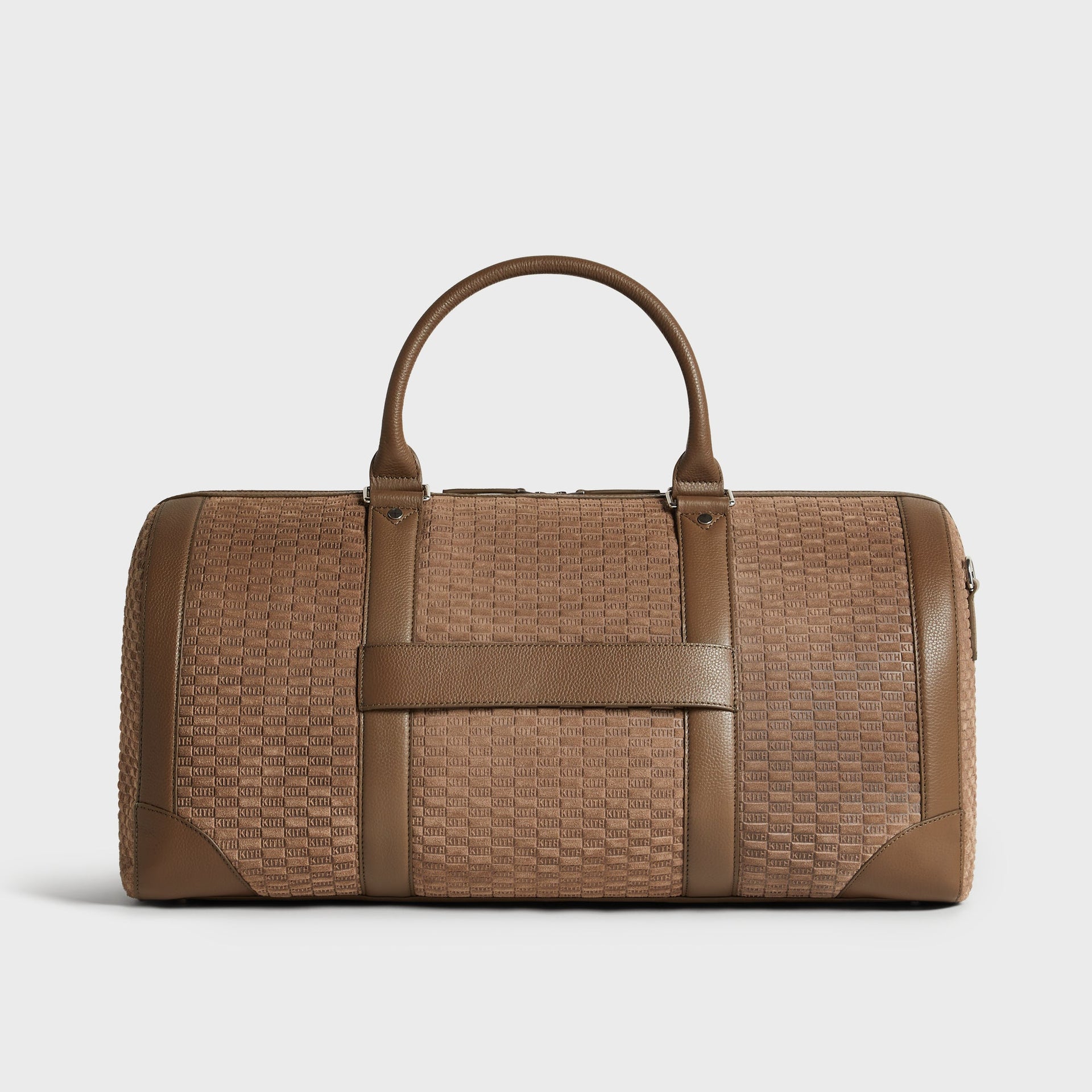 Kith Suede Traveler K55 Duffle Bag front view with top handles and horizontal carry strap, embossed KITH suede