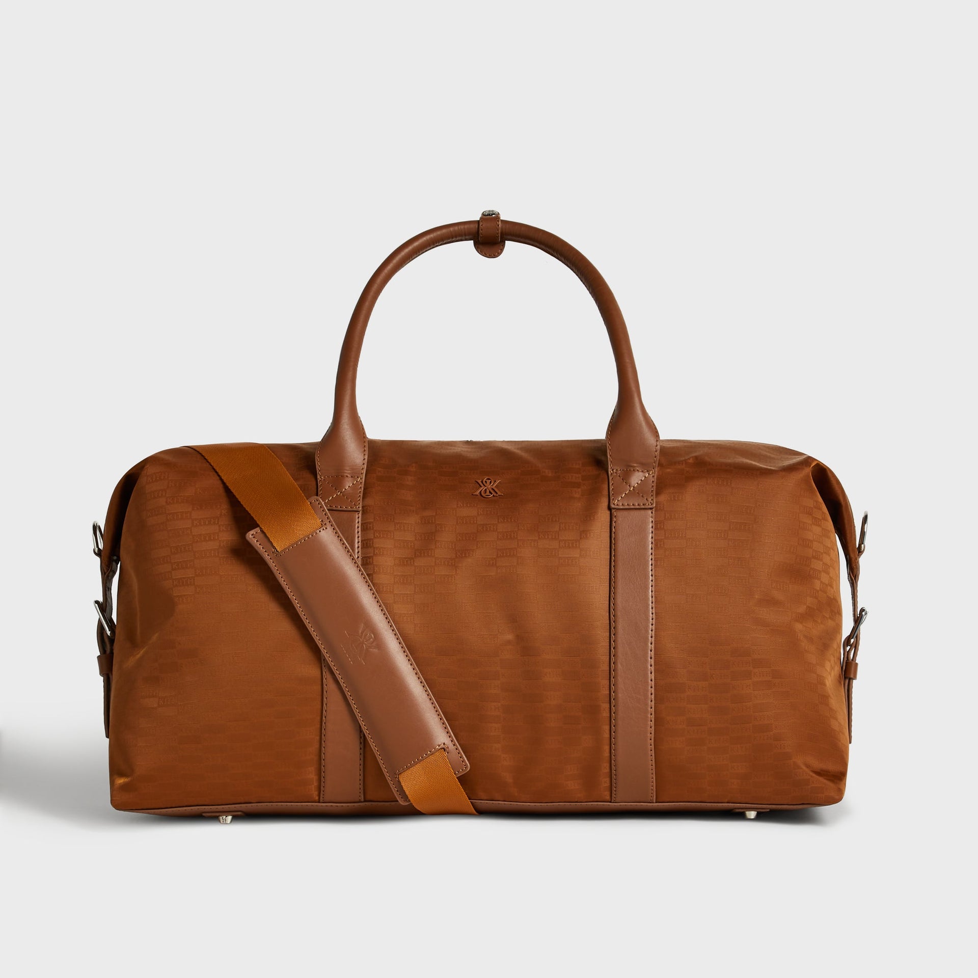 Kith Monogram Nylon Leather Duffle Bag in Tectonic, front view with jacquard monogram pattern and rolled leather handles