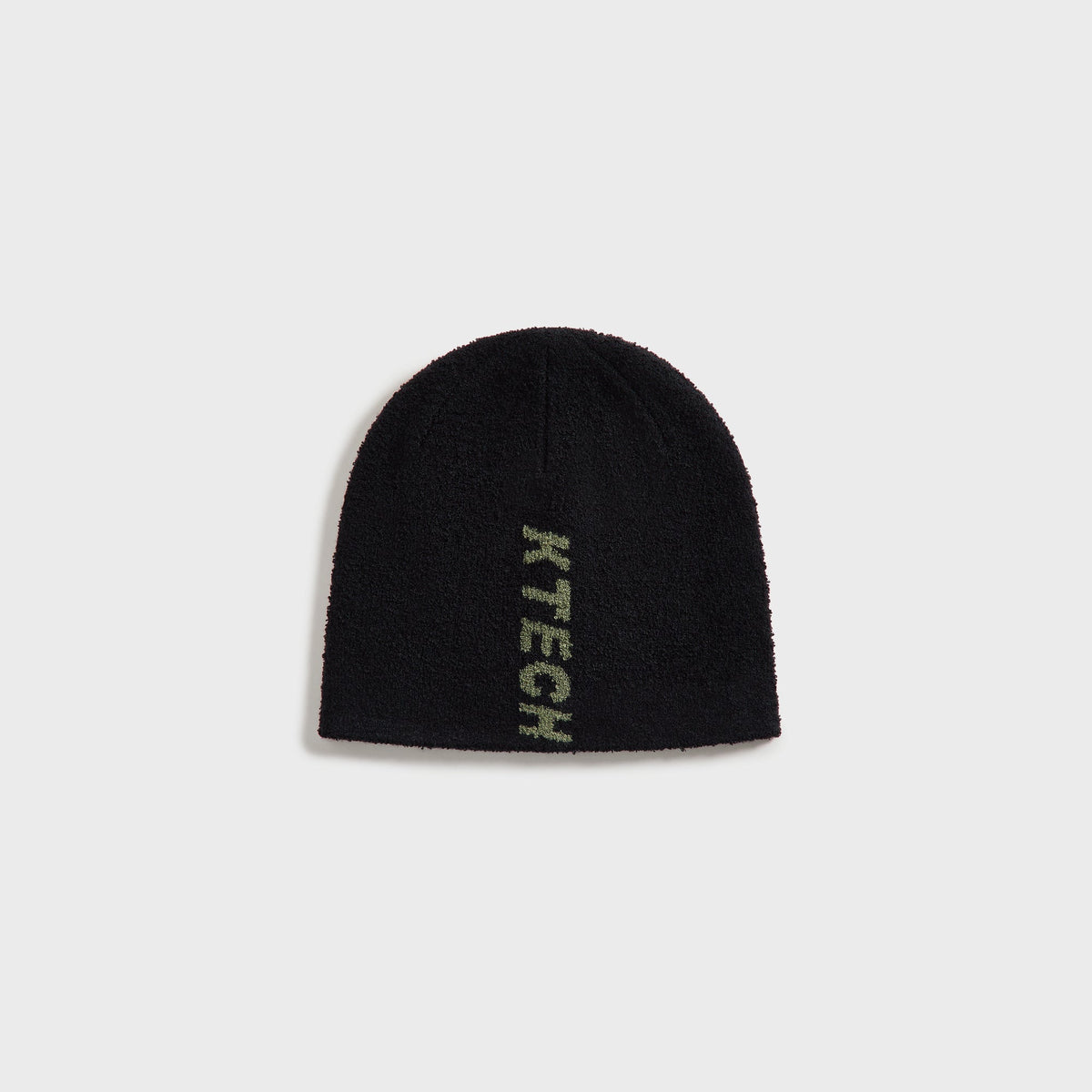 Kith Boucle Cuffless Beanie in black with green KTECH logo knit into the side, front view