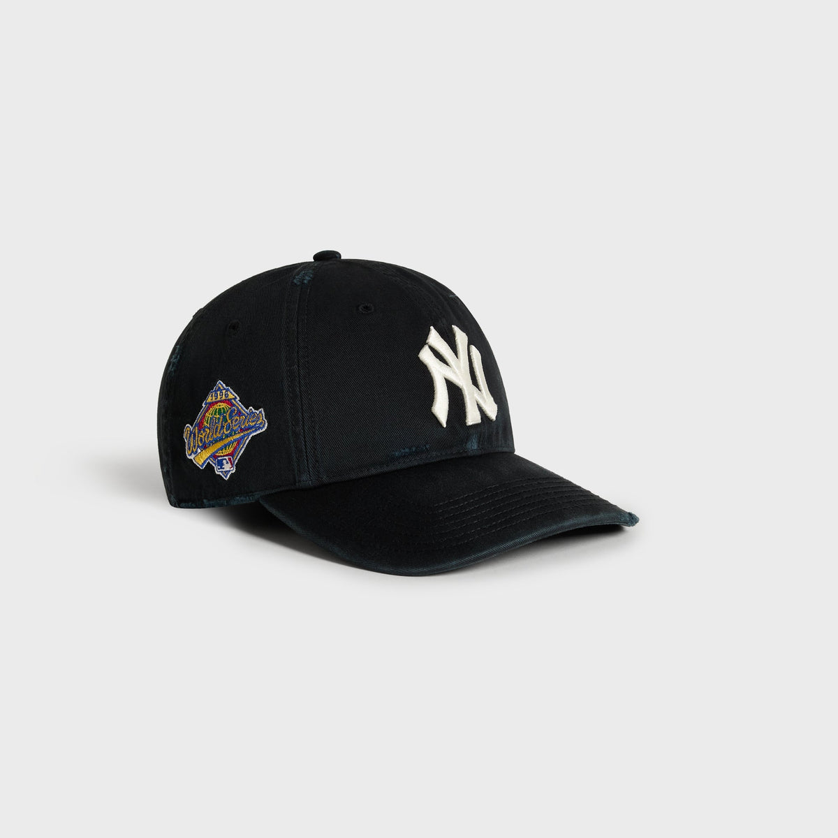 Kith & '47 Sun Faded Franchise LS Cap in Black, angled view showing NY logo and 1996 World Series patch