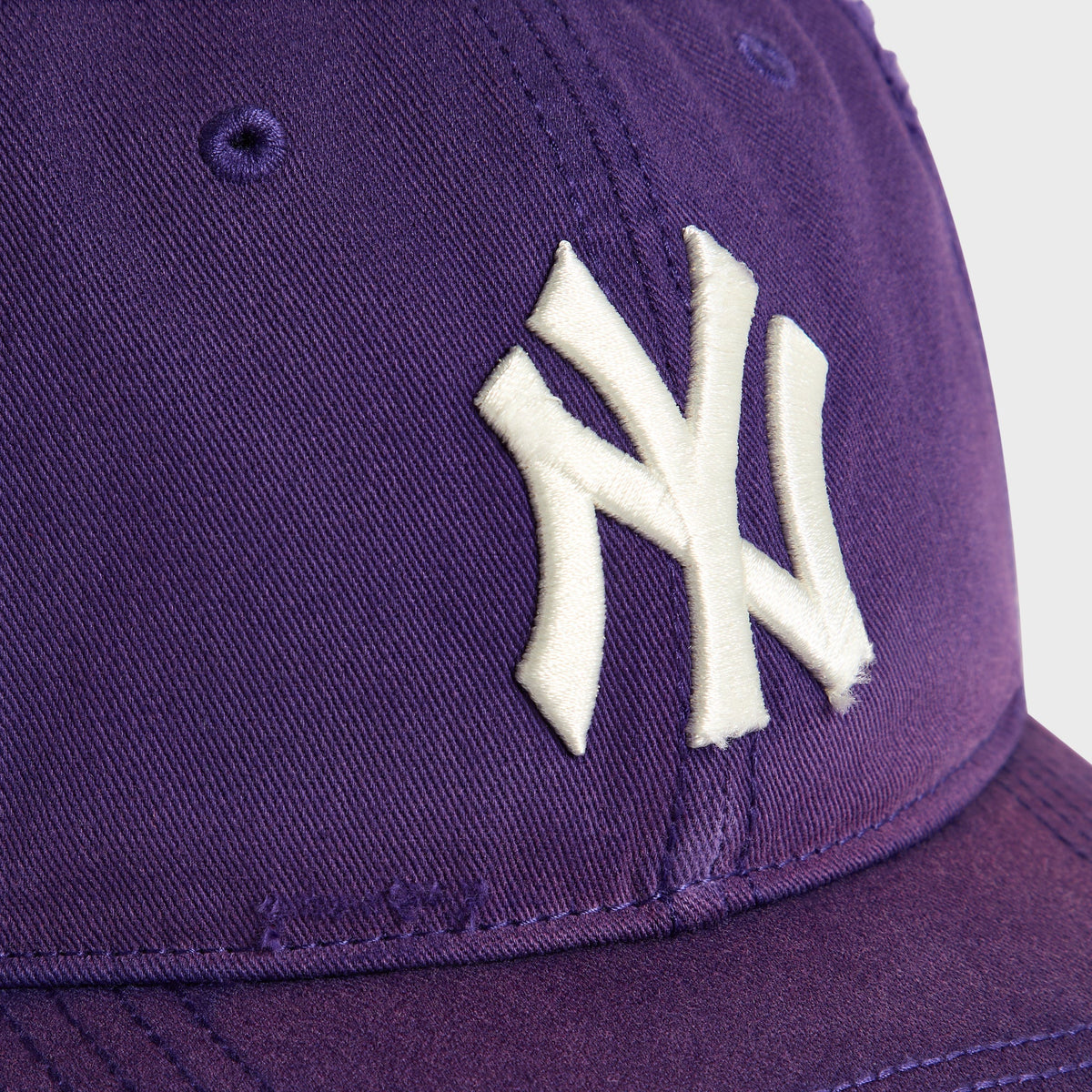 Kith & '47 Yankees cap in Solitaire purple - close-up detail of embroidered NY logo on crown