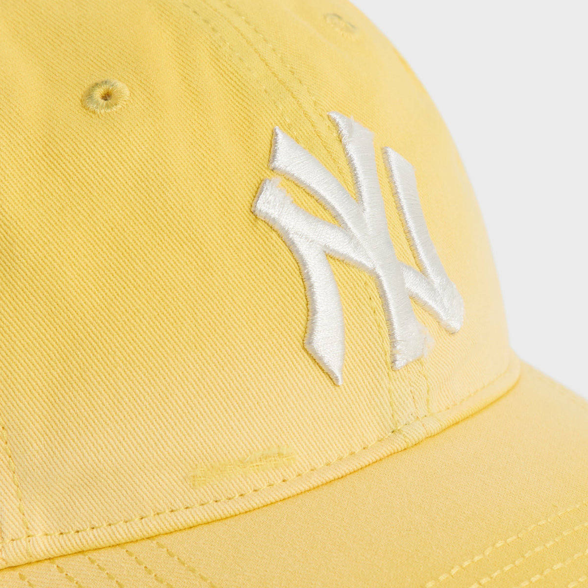 Close-up of white NY logo embroidery on Buzz Sun Faded Franchise LS Cap