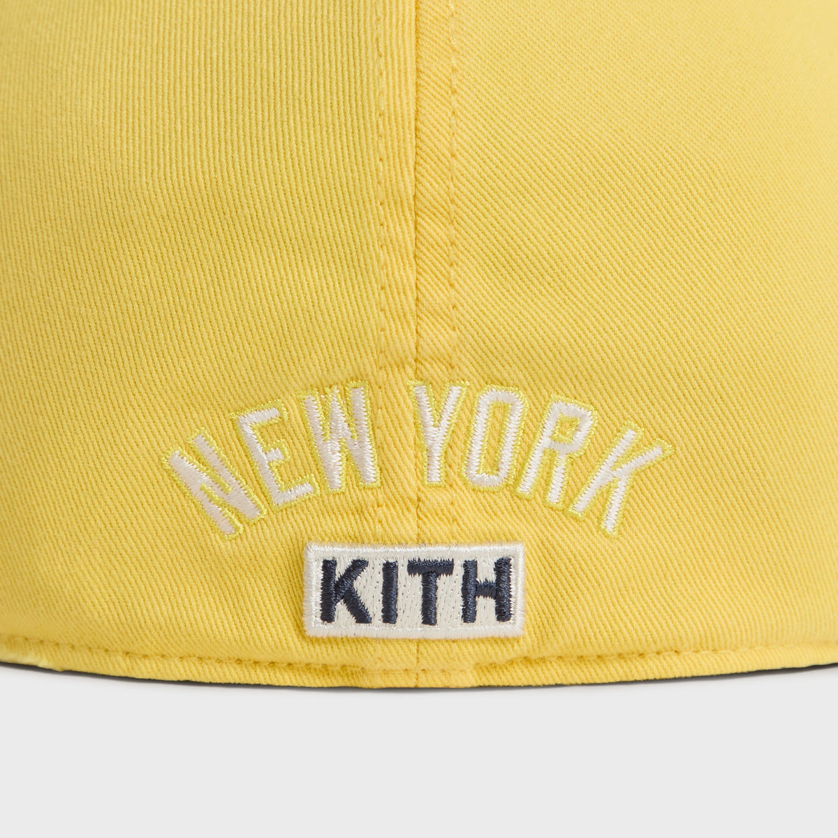 Close-up back detail of New York Kith text embroidery on Buzz Sun Faded Franchise LS Cap