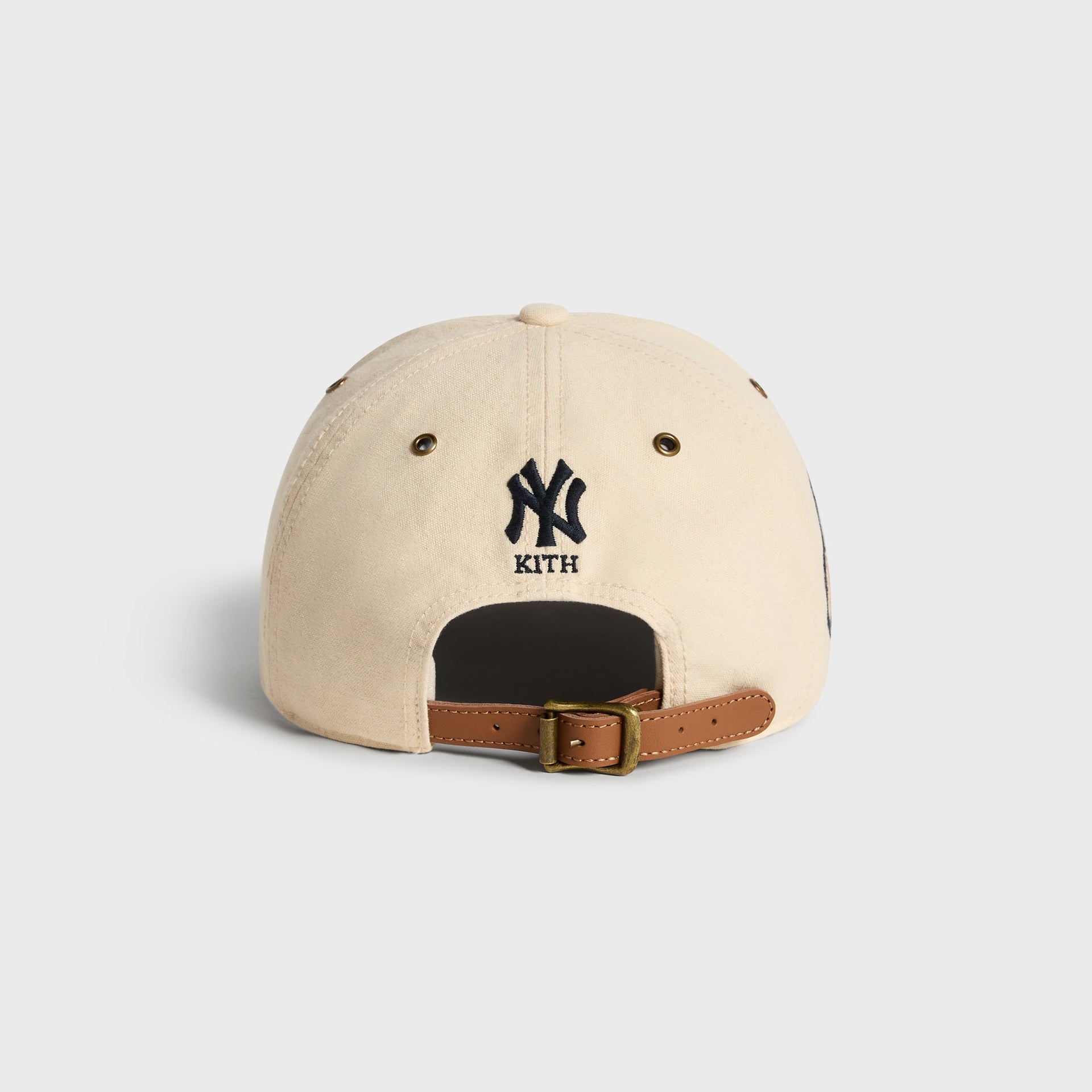 Kith & '47 Clean Up Duck Canvas Long Visor Cap in Sandrift, back view with NY Kith logo above leather strap buckle