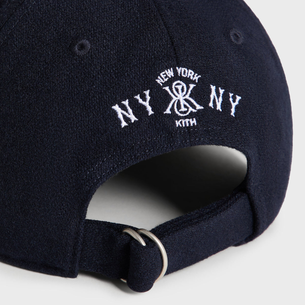 Kith & '47 Wool Clean Up Cap in Nocturnal - close-up detail of back strap buckle with NY x Kith logo