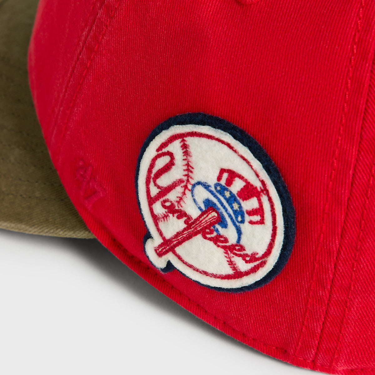 Close-up of circular vintage New York Yankees side patch on Retro Round Visor Cap