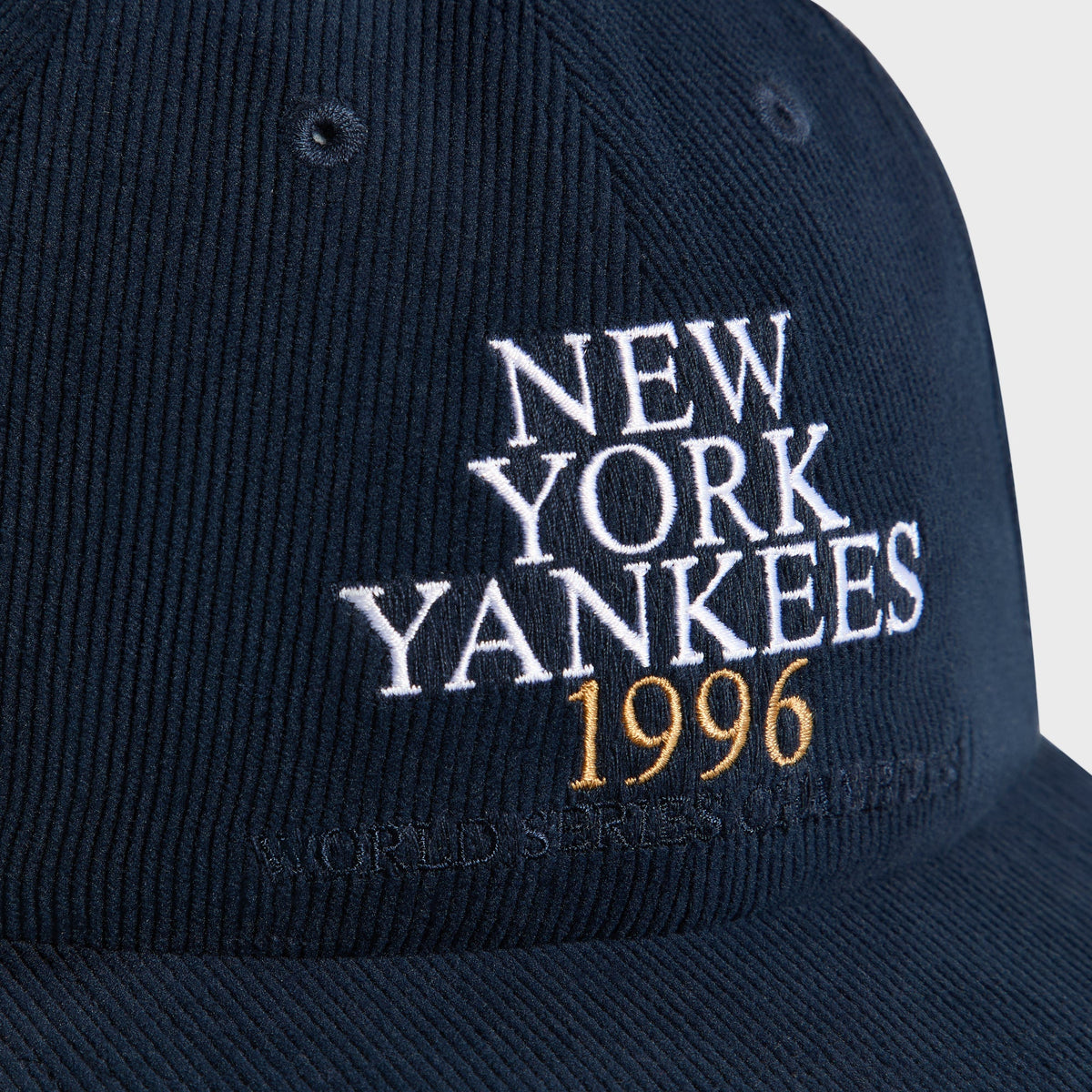 Close-up of New York Yankees 1996 World Series Champions text embroidery on Nocturnal corduroy cap