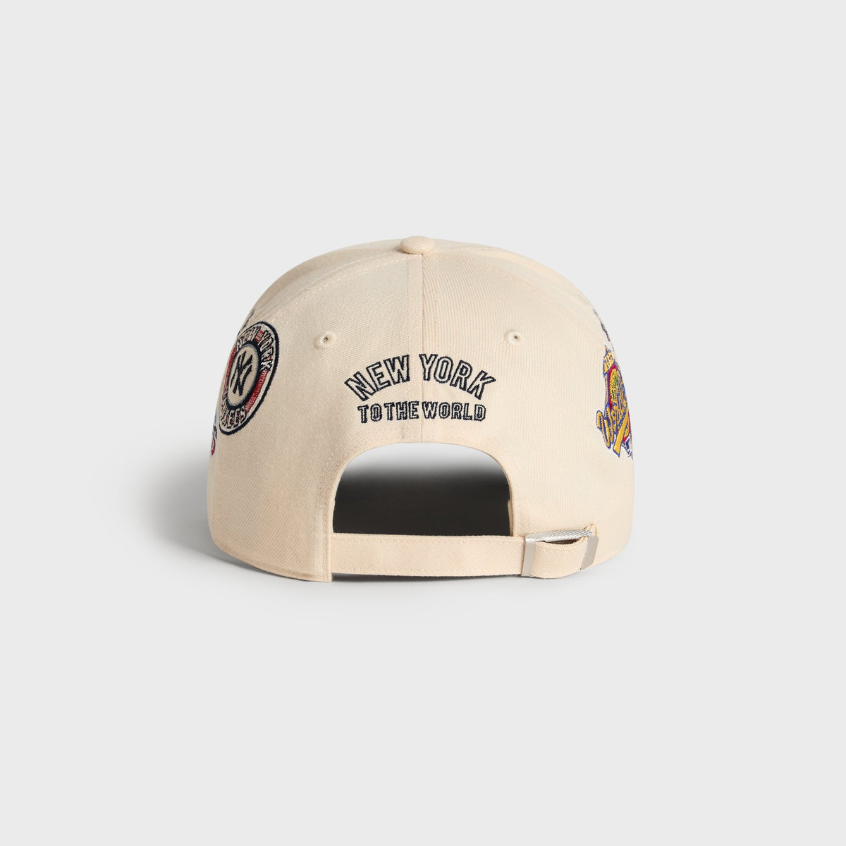 Kith & '47 Ballpark Offside DT Cap in Sandrift, back view showing New York To The World embroidery above strap