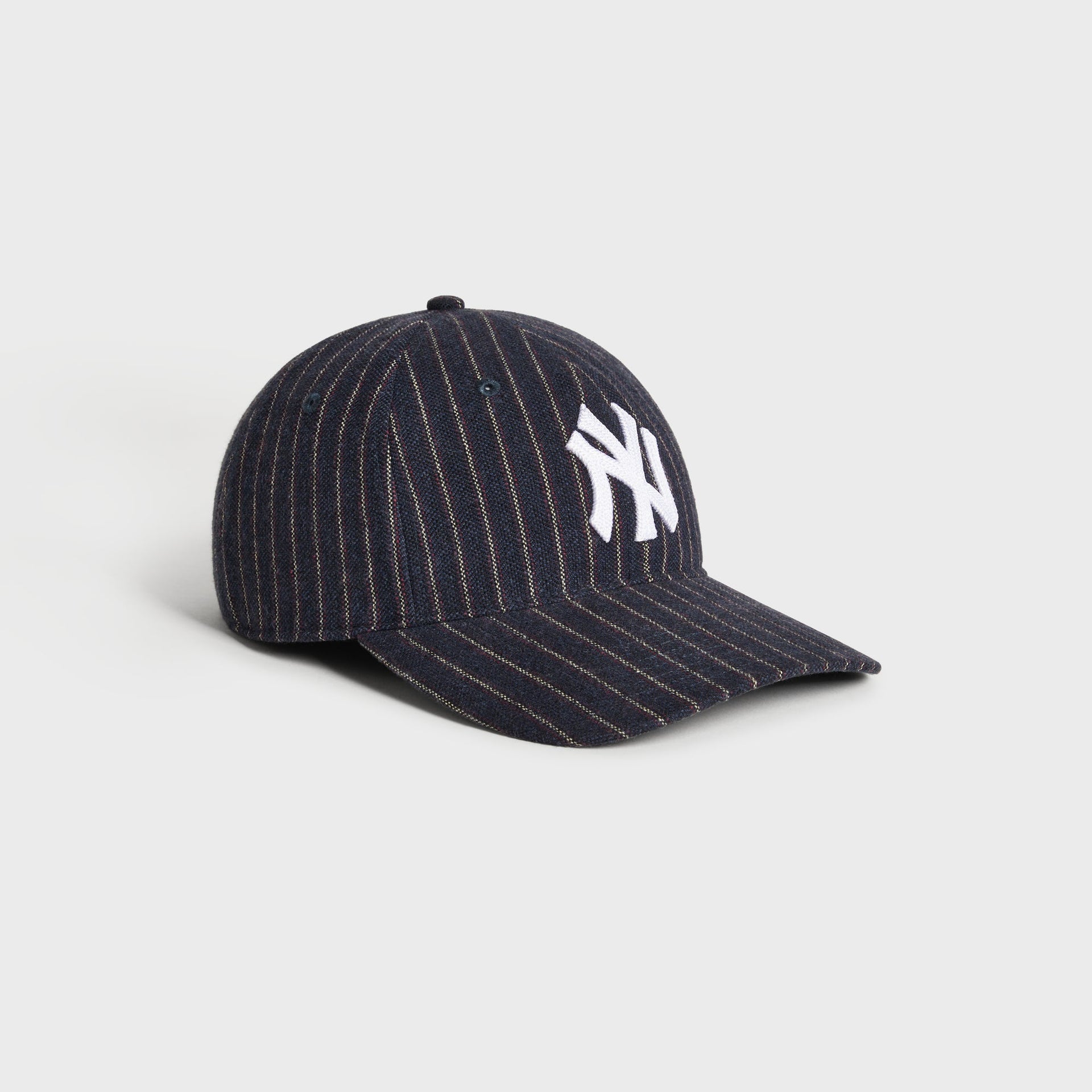 Kith & '47 Yankees Barre Stripe Franchise cap, angled 3/4 view showing curved brim and pinstripe wool
