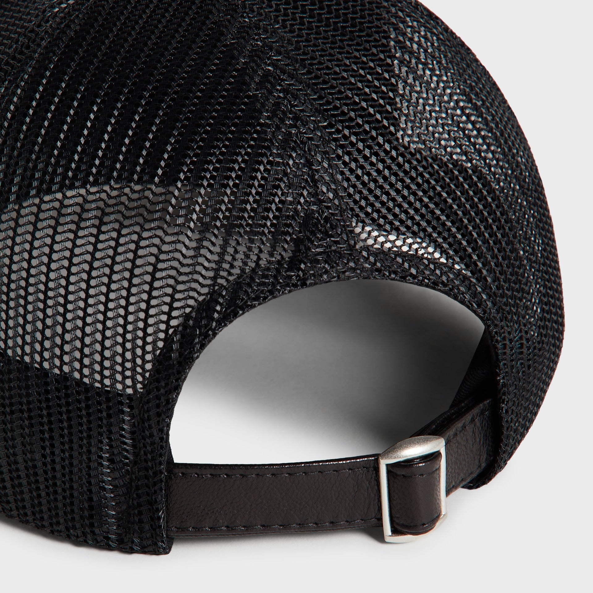 Kith Smooth Leather Nolan Trucker Hat in Black, macro detail of leather strap and metal buckle