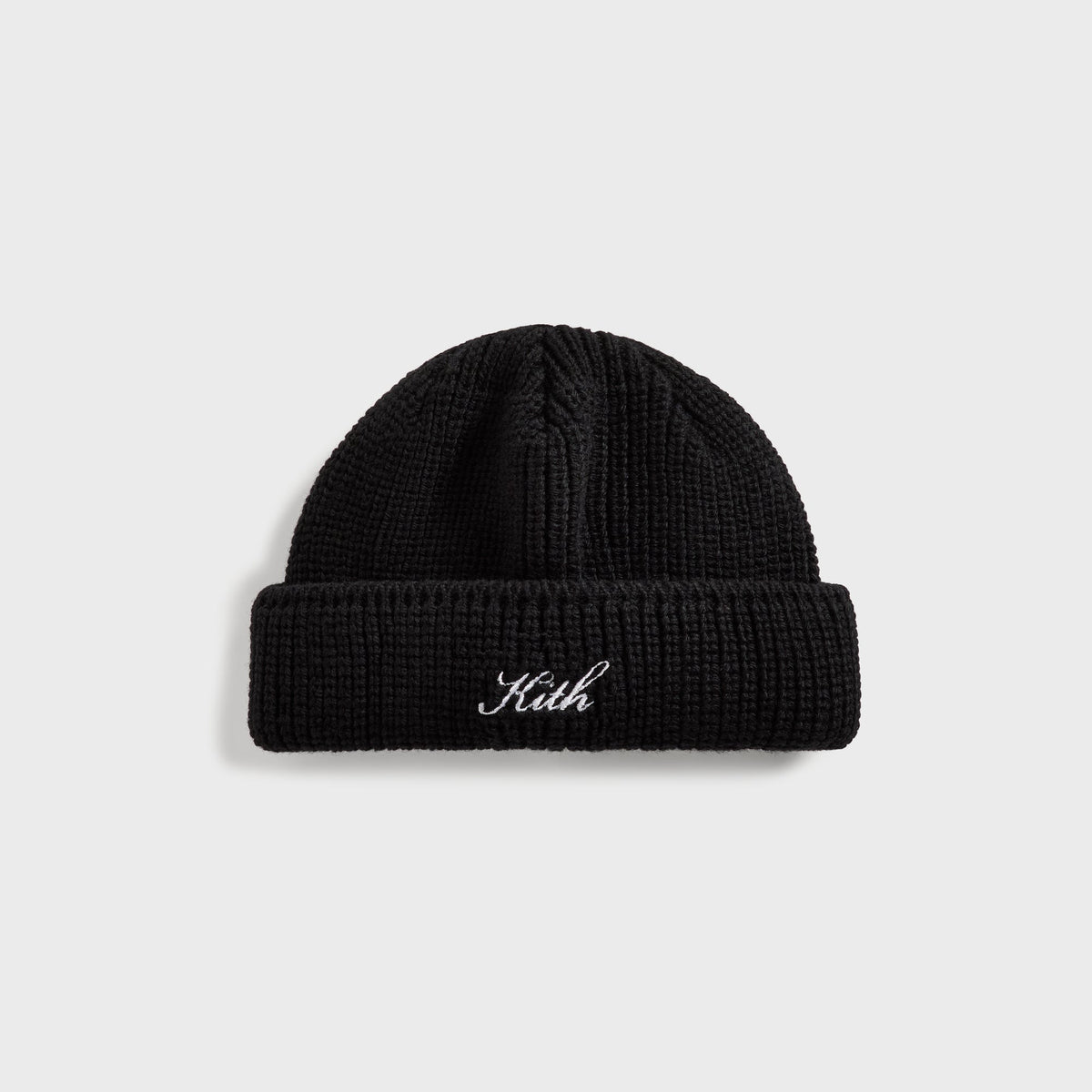 Kith Script Shallow Beanie in black with white Kith script embroidery on cuff, front view