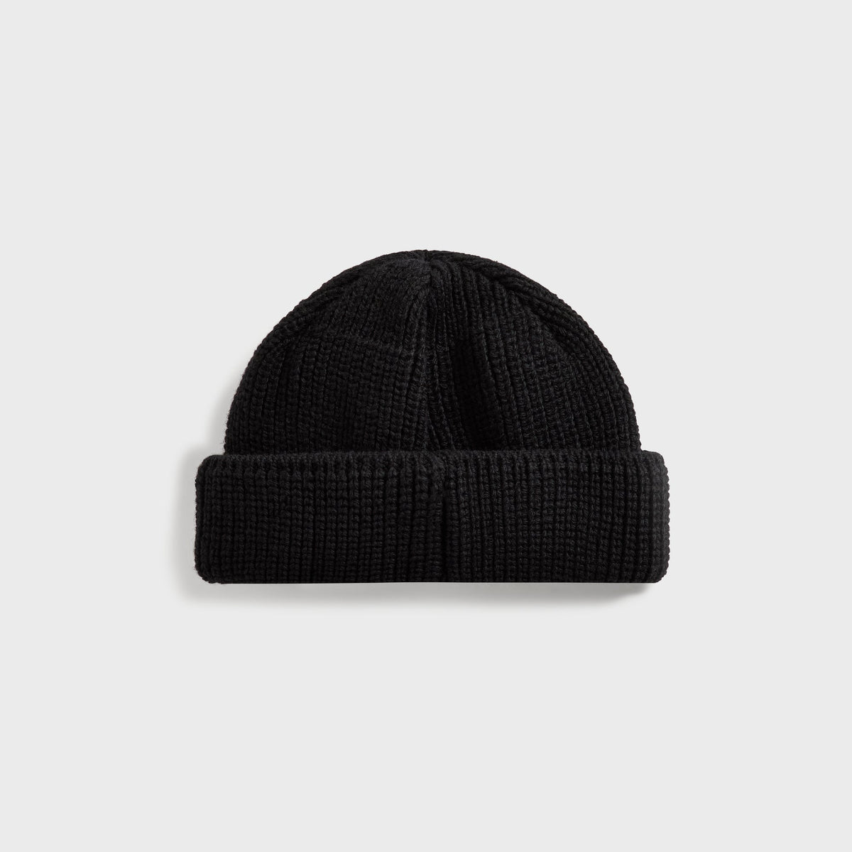 Kith Script Shallow Beanie in black ribbed knit, back view with plain cuff