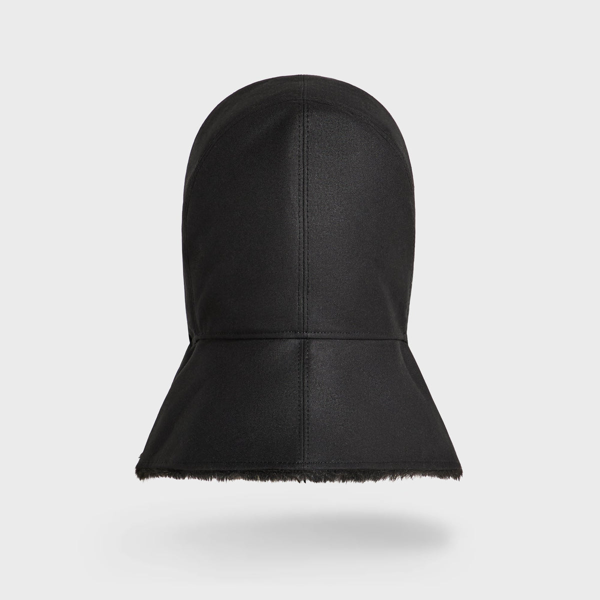 Kith Shearling Lined Waxed Canvas Trapper Hat in black, back view of waxed canvas
