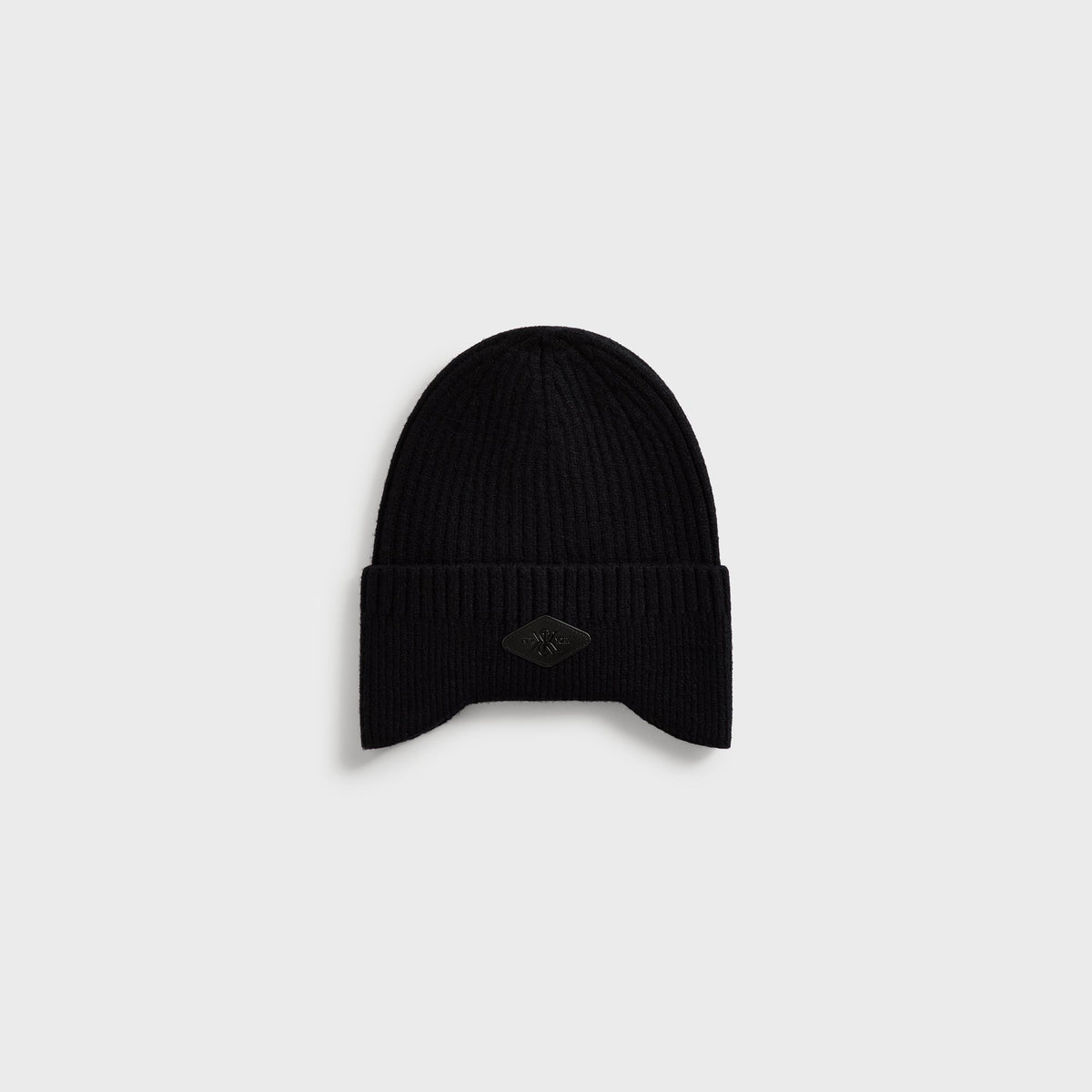 Kith Chunky Knit Earflap Beanie in black ribbed knit with small leather logo patch, front view