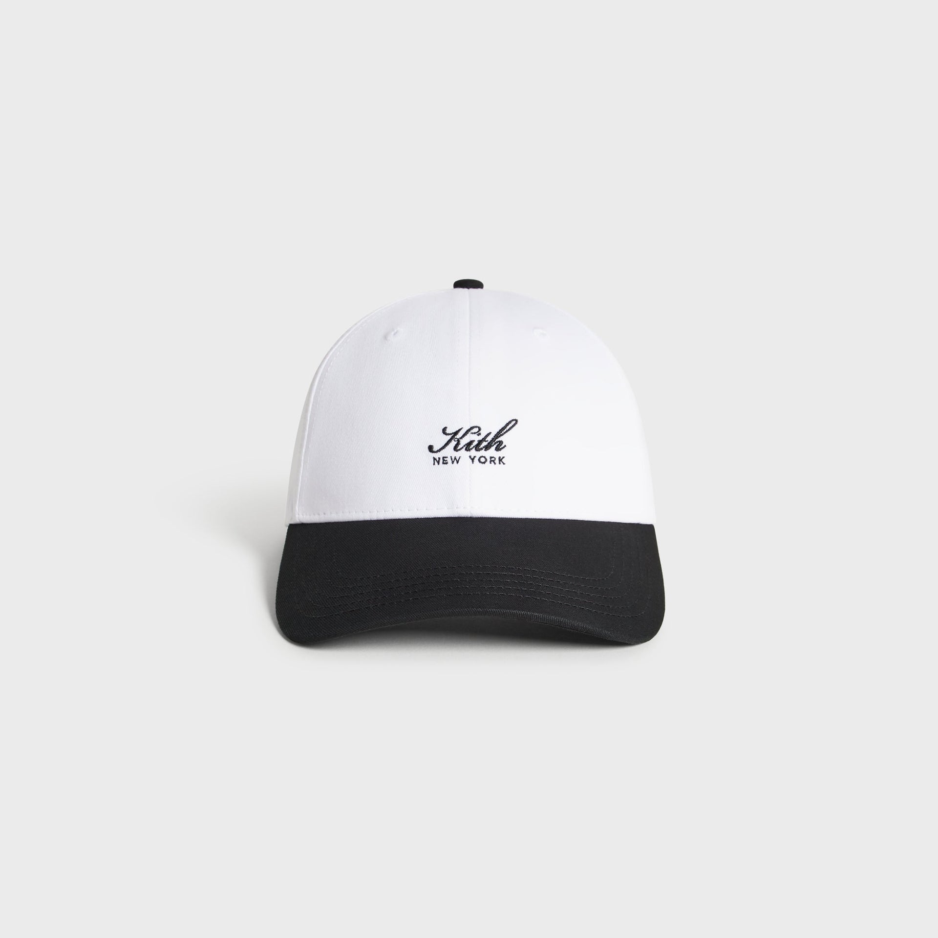 Kith Script Two Tone classic cap in white with black brim, front view