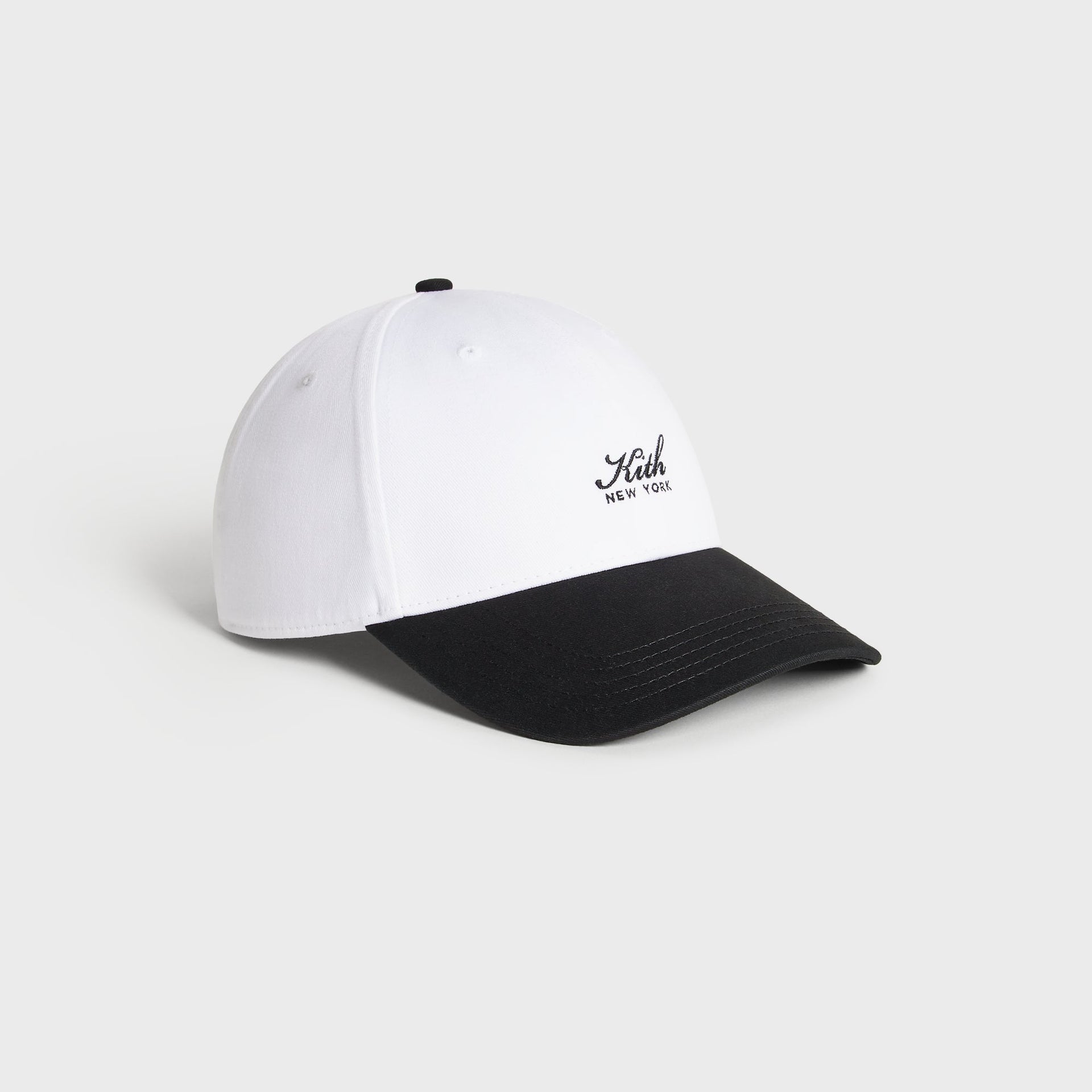 Kith Script Two Tone classic cap in white with black brim, side profile view