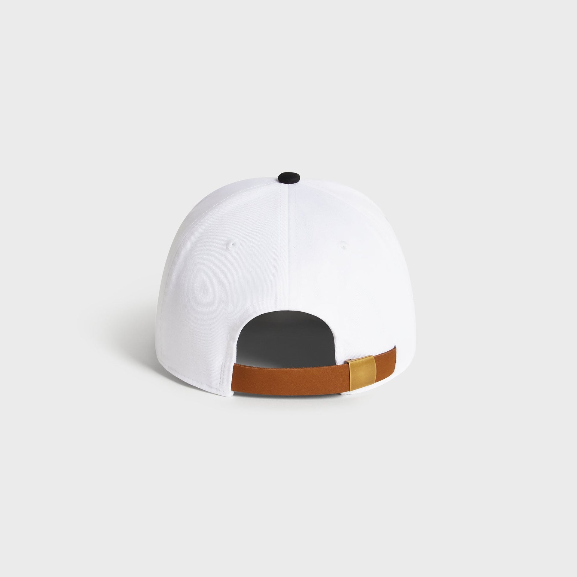 Kith Script Two Tone classic cap in white with black brim, back view showing adjustable strap