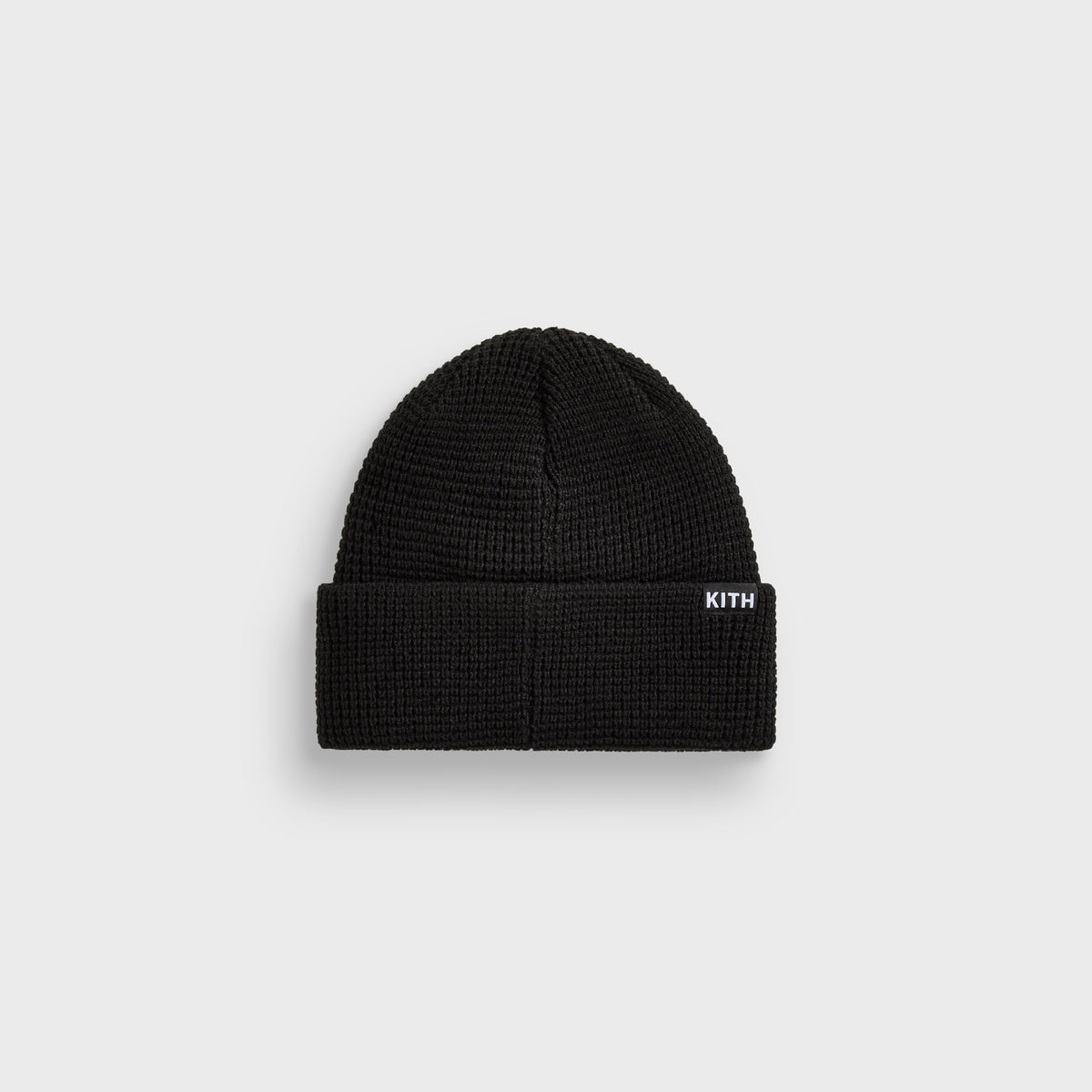 Kith & '47 Mets waffle knit beanie in black, back view with white Kith box label on cuff