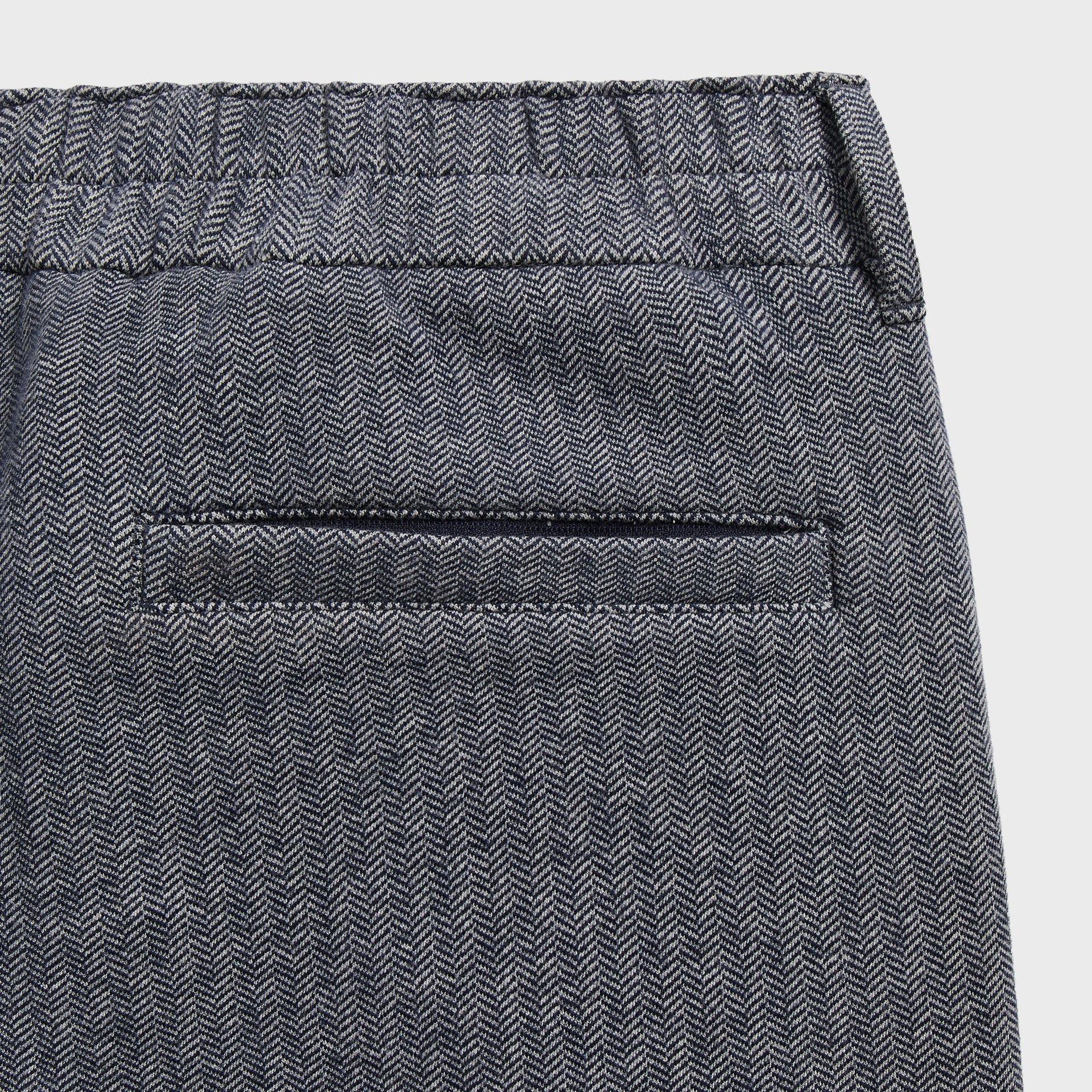 &Kin Bryson Sweatpant detail: elastic back waistband and welt pocket in Nocturnal herringbone
