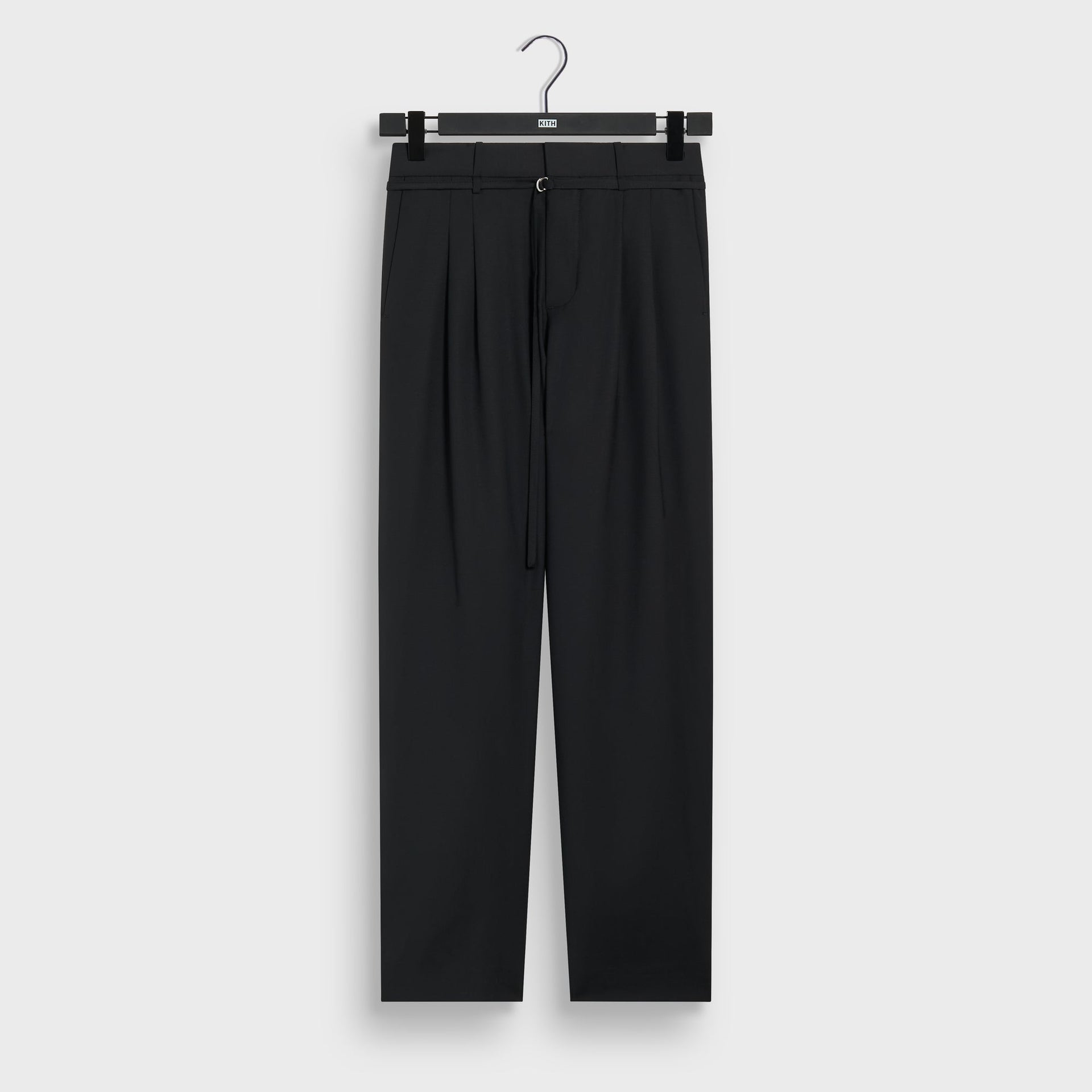 &Kin Tropical Wool Eli Pleated Trouser in Black, front view on hanger with pleats and D-ring belt tie